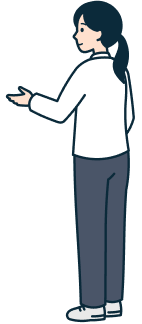 手を上げたお客さま（女性）の全身背面斜め