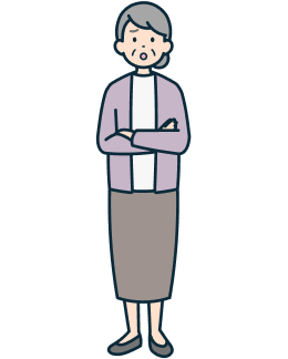 腕を組んだ困り顔の高齢のお客さま（女性）の全身