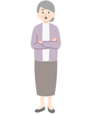 腕を組んだ困り顔の高齢のお客さま（女性）の全身
