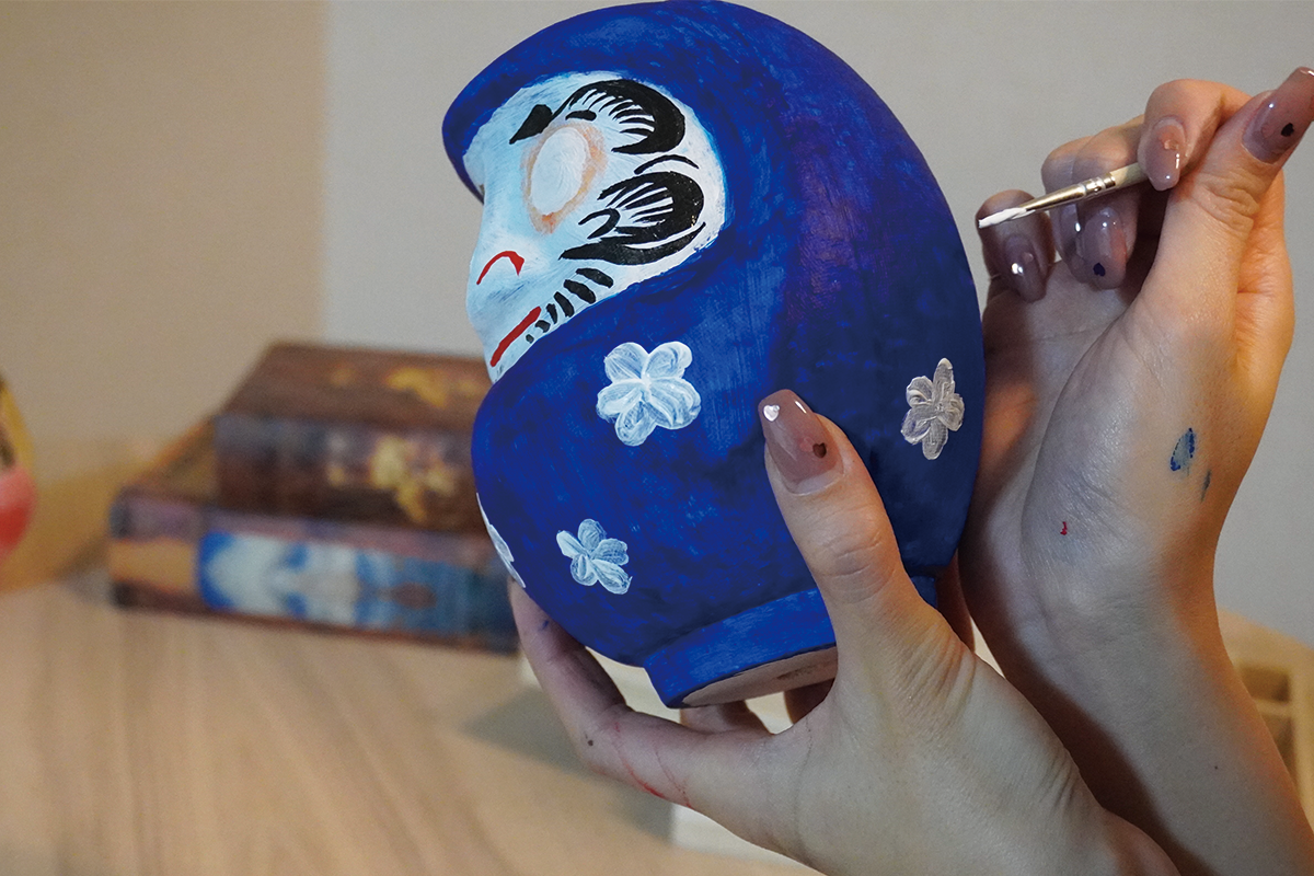 A blue Daruma completed with the kit