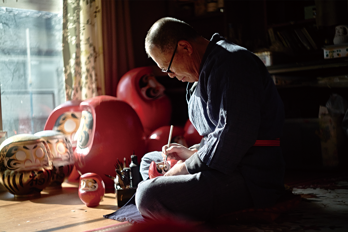 Artisan crafting at Takeuchi Daruma workshop