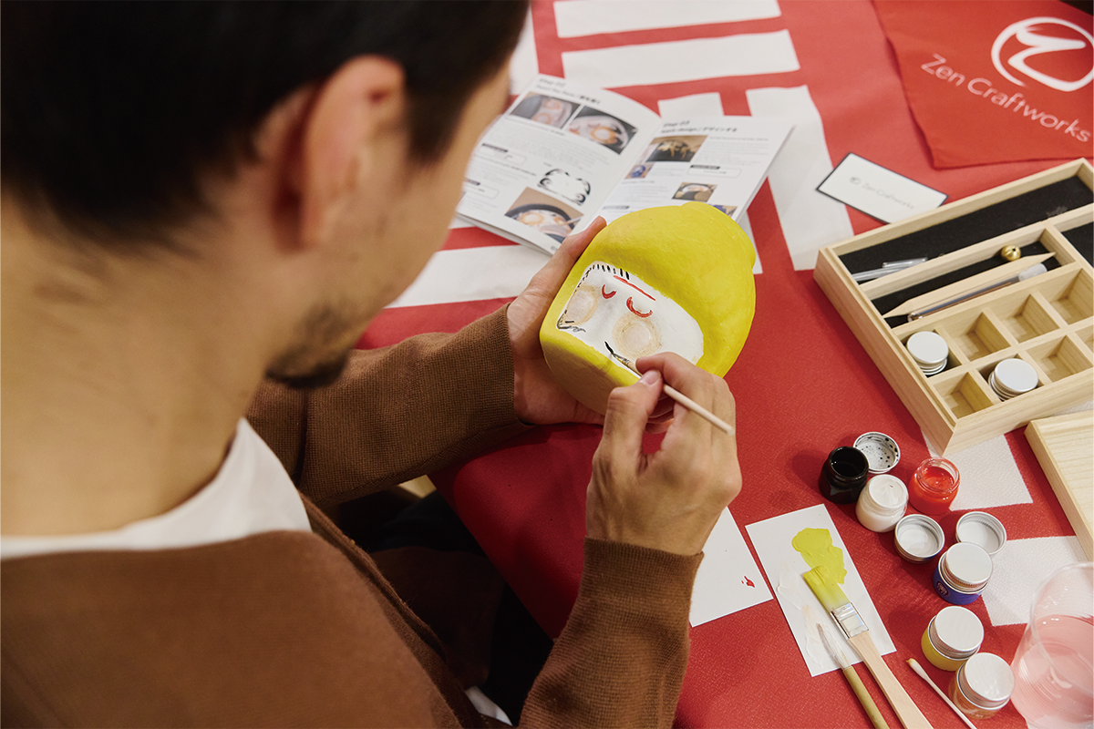 Daruma painting experience in progress
