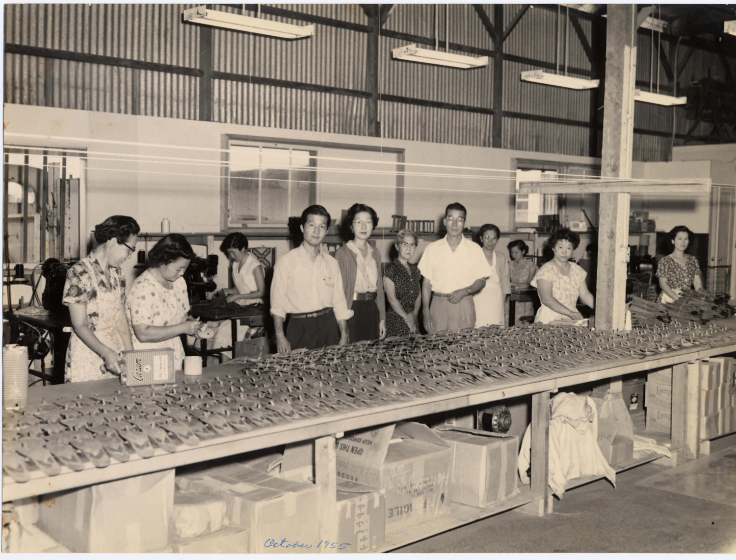 Staff at the factory during the early days of the brand. Motonaga can be seen in the middle.