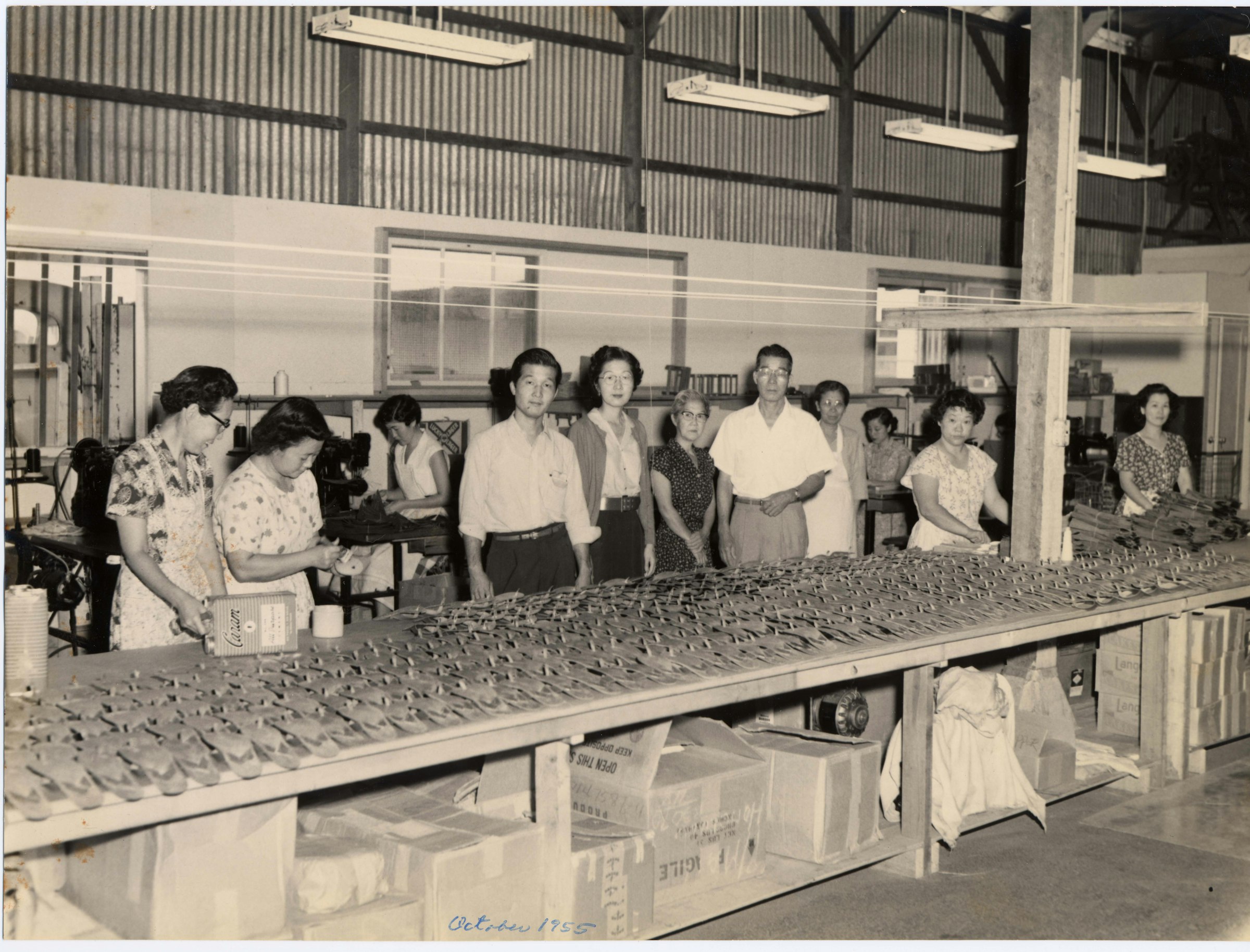 Staff at the factory during the early days of the brand. Motonaga can be seen in the middle.