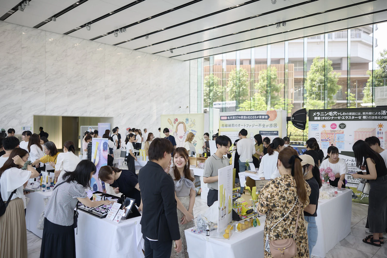 Each booth was crowded with people listening to product explanations