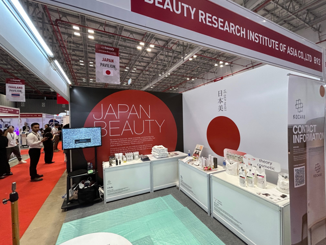 [Photo: Joint booth of the three companies]