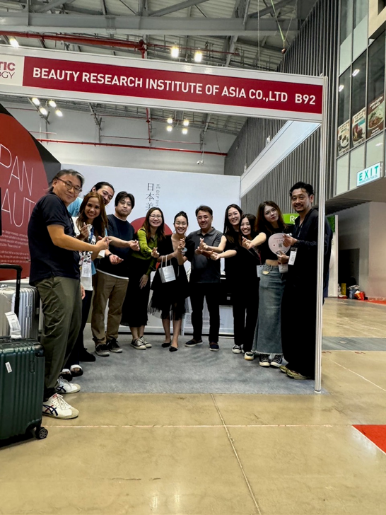 [Photo: Group photo taken after the exhibition]