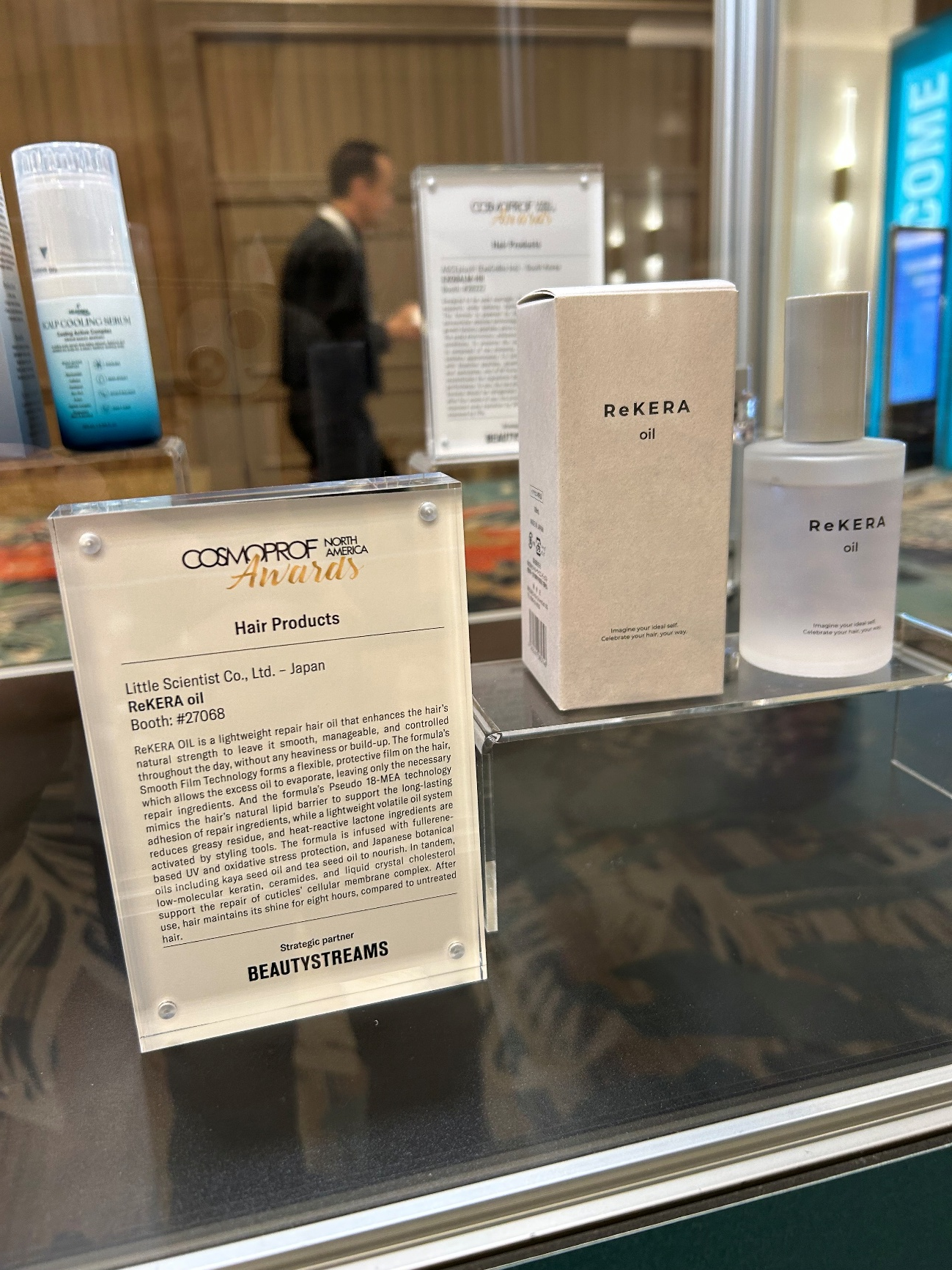 [Photo: Products displayed along the main aisle of the exhibition venue]