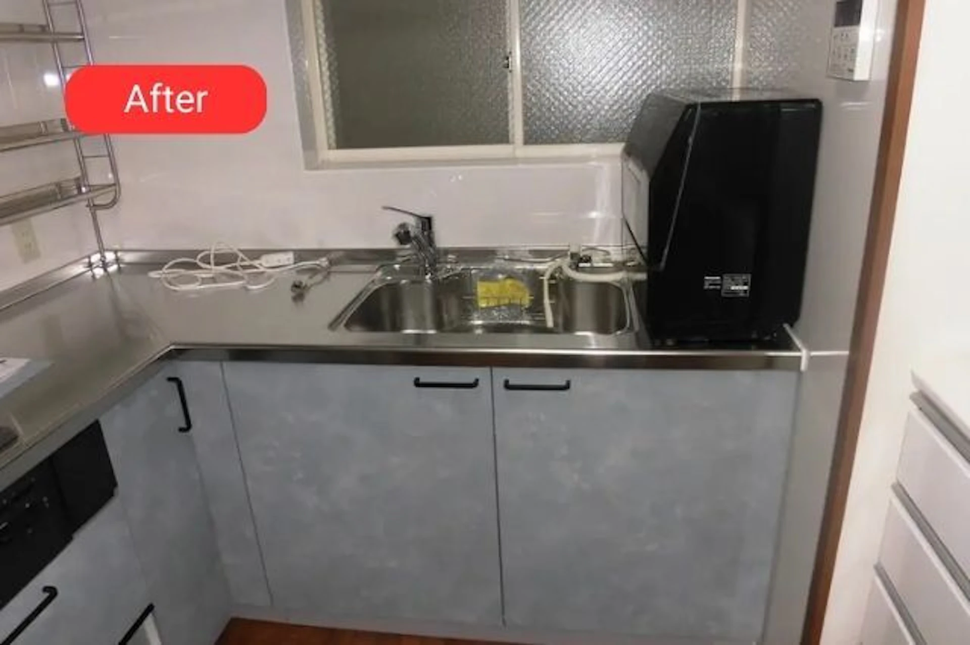 グレー基調のL型キッチンのリフォーム後の写真