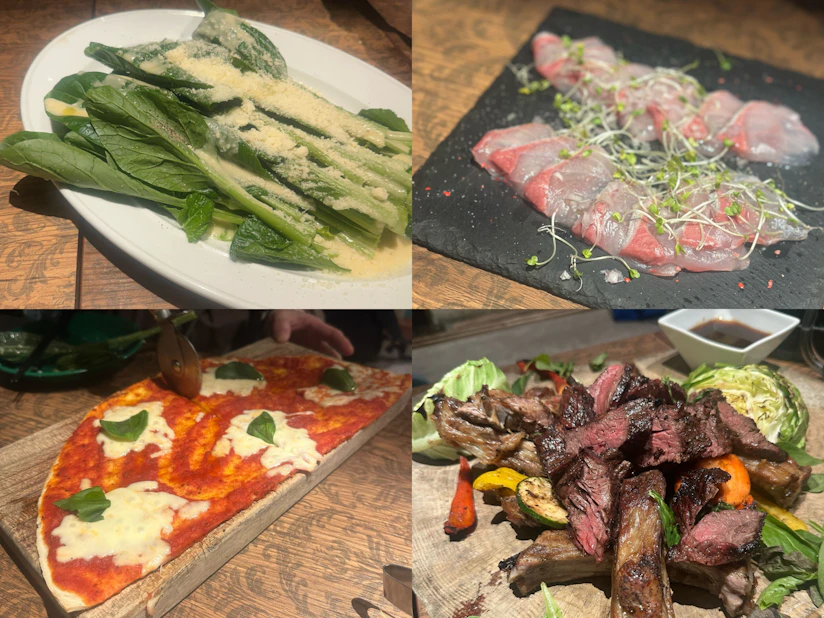 小松菜のサラダやカルパッチョ、ピザ、肉料理などが並んでいる写真。