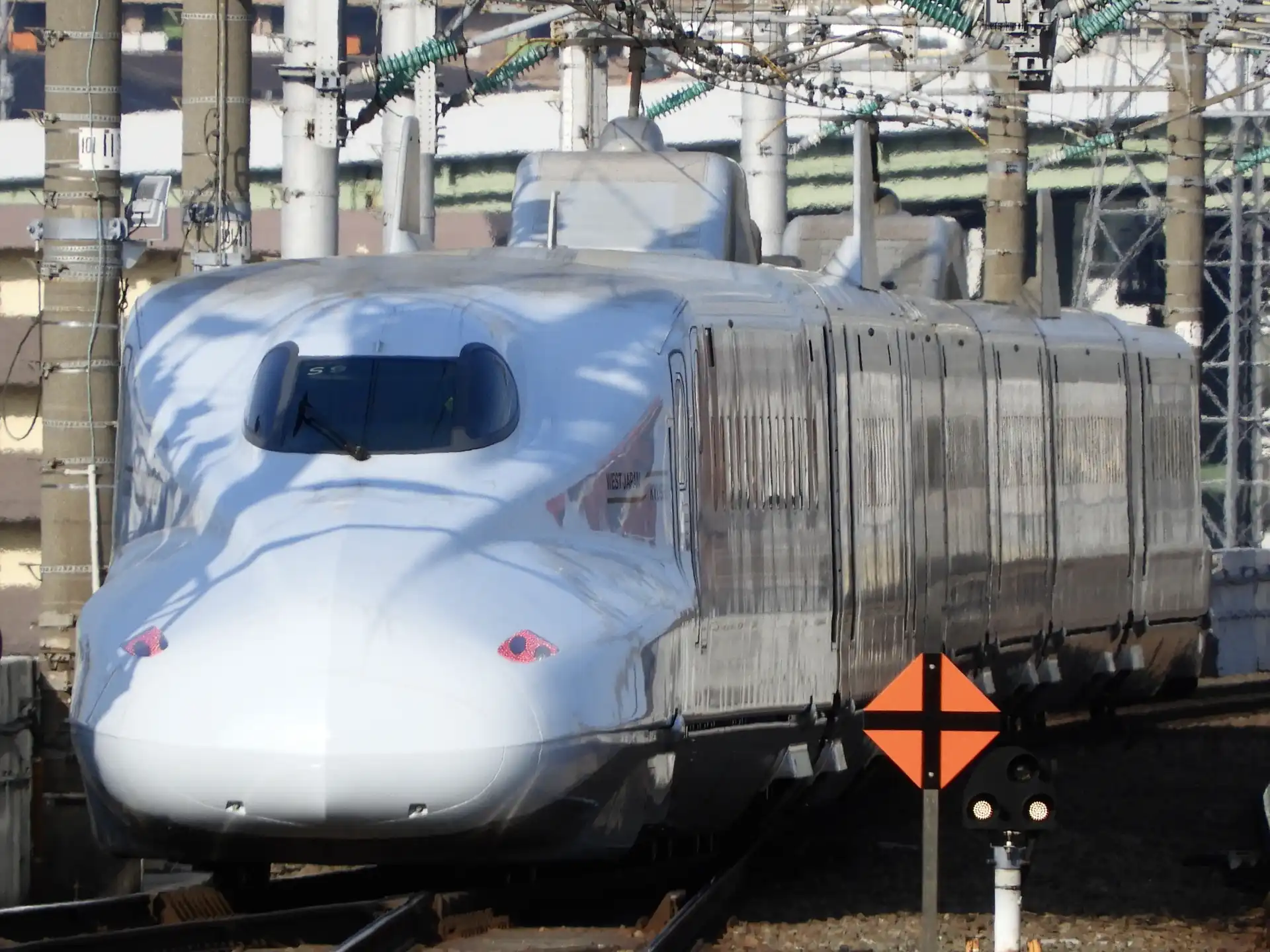 Kokura Station platform view of the Sakura bullet train starting its journey