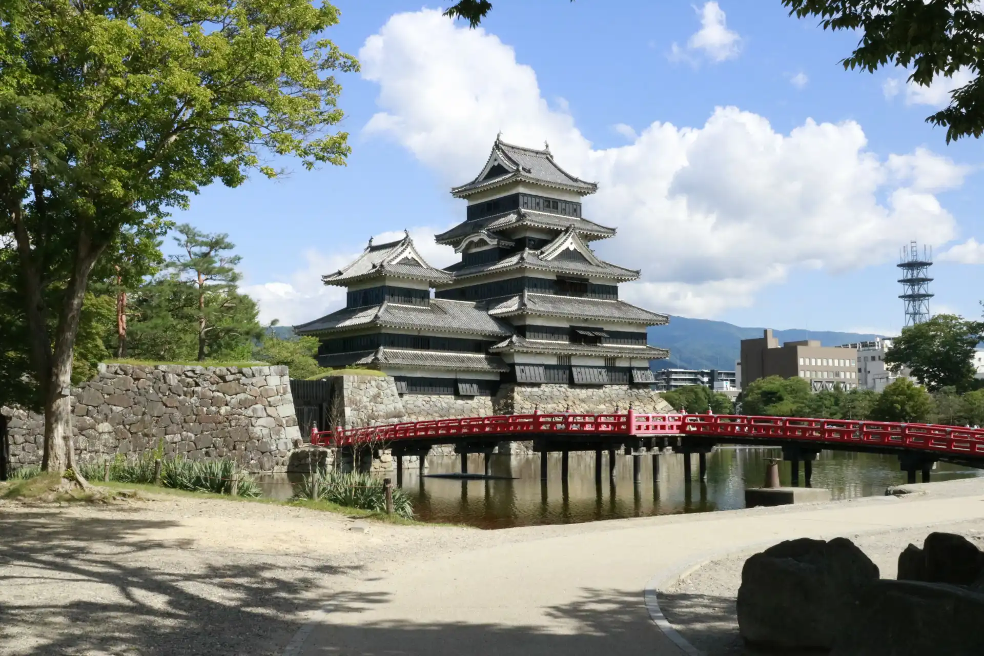 Matsumoto Castle with its iconic red bridge and black wooden exterior in Nagano