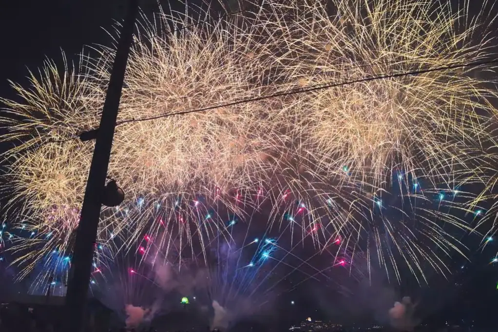 Grand fireworks display lighting up the night sky over the coast during Ito Anjin Fireworks Festival