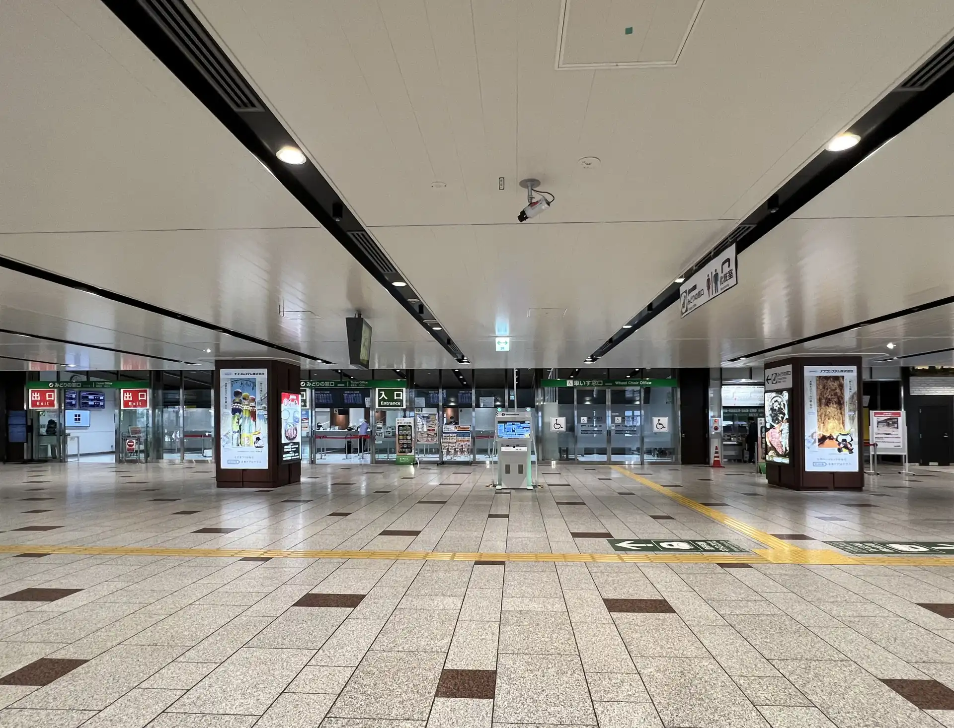 Sendai Station main concourse area showing entrances, exits, and digital displays