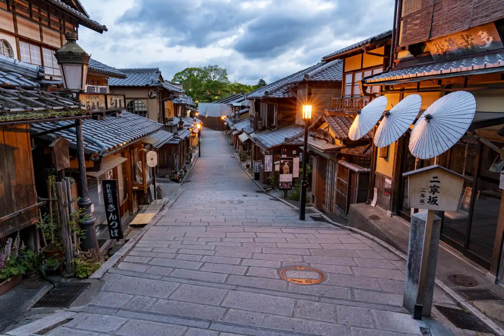 Traditional street on the Kiyomizu-dera approach in Kyoto, with preserved wooden buildings along the stone-paved slope