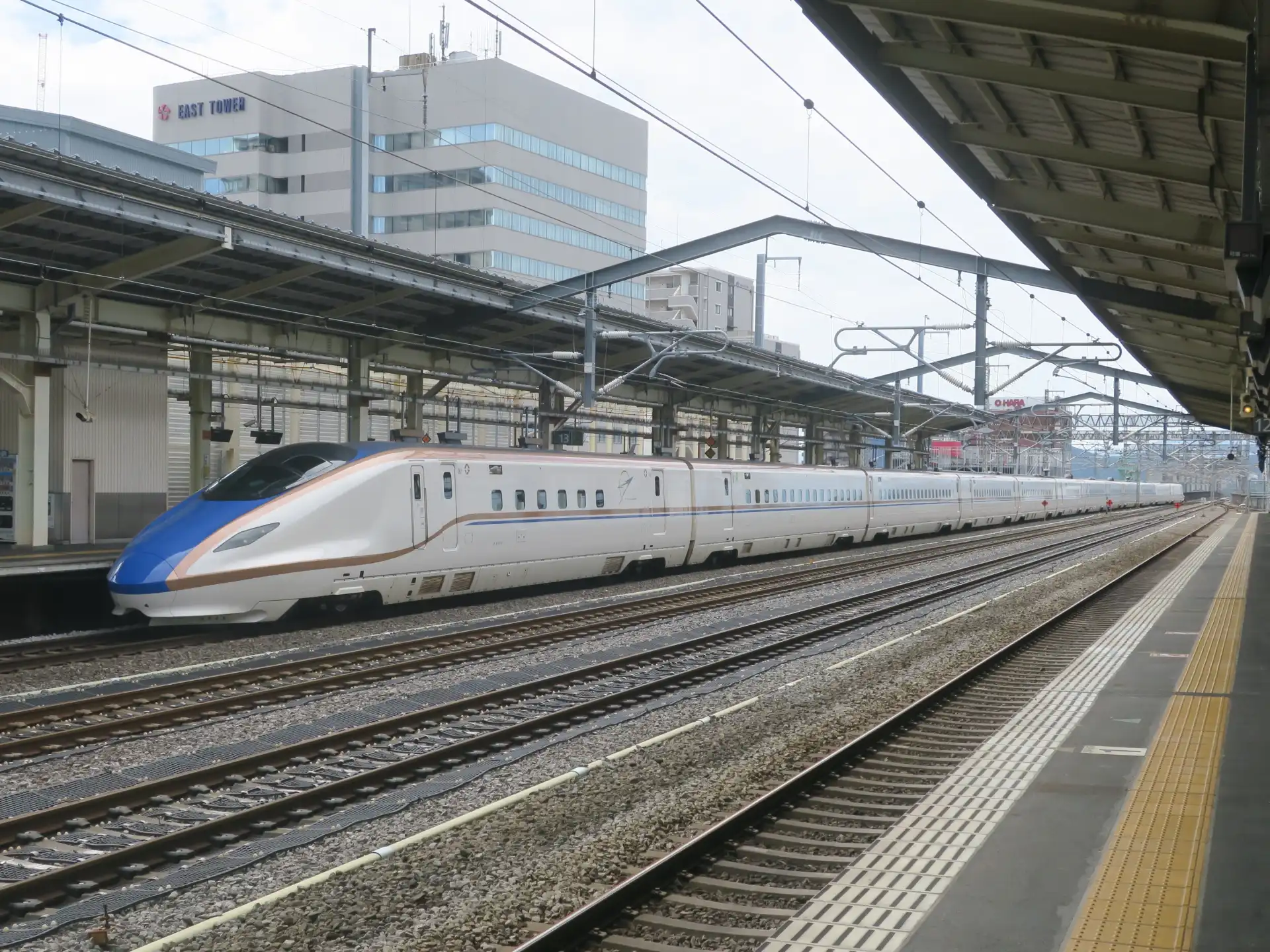 Takasaki Station platform view with a Joetsu Shinkansen bound for Niigata