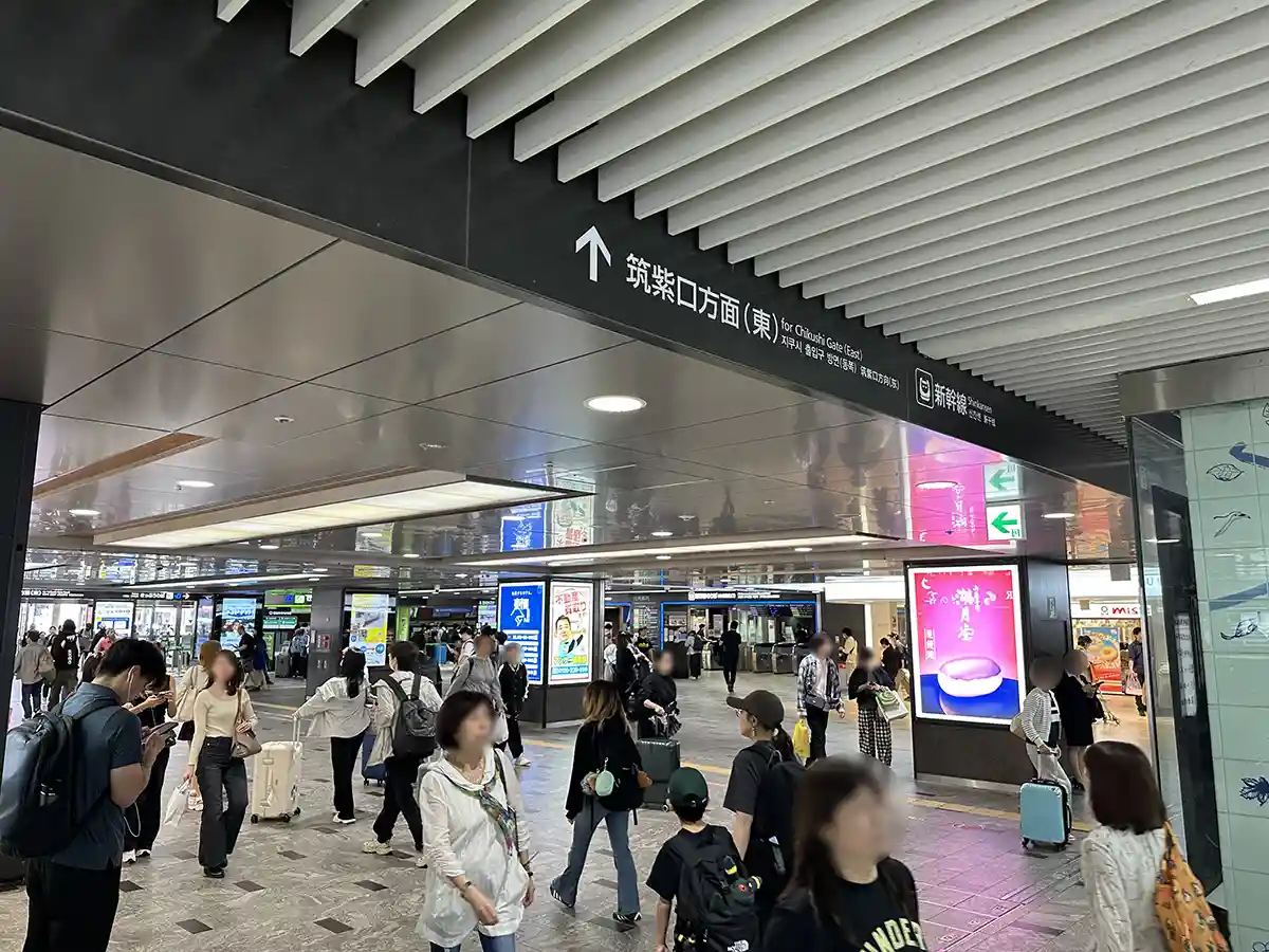 Interior passage at Hakata Station leading from the Chikushi Exit area to the Shinkansen entrance