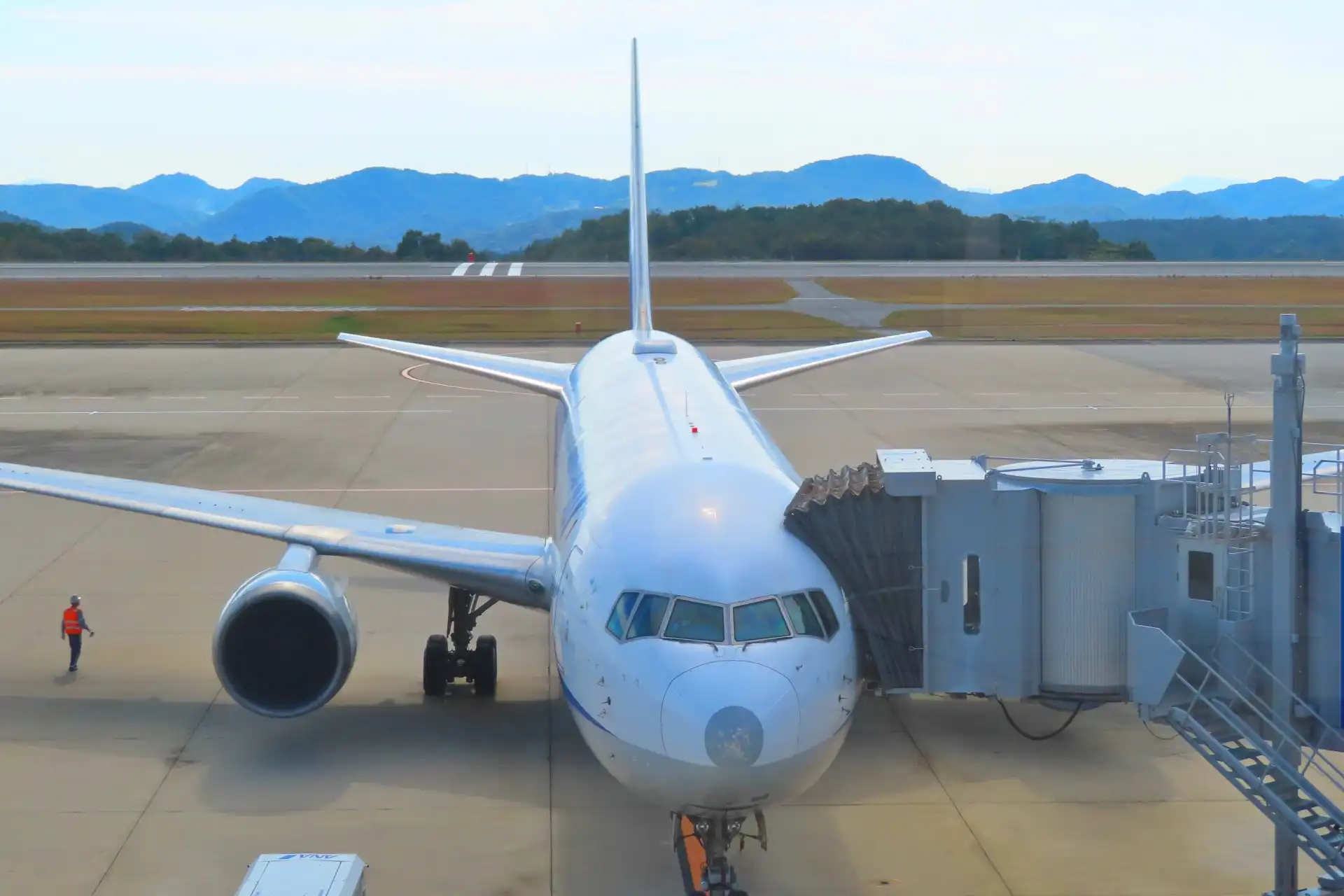 Airplane docked at the terminal gate of Hiroshima Airport