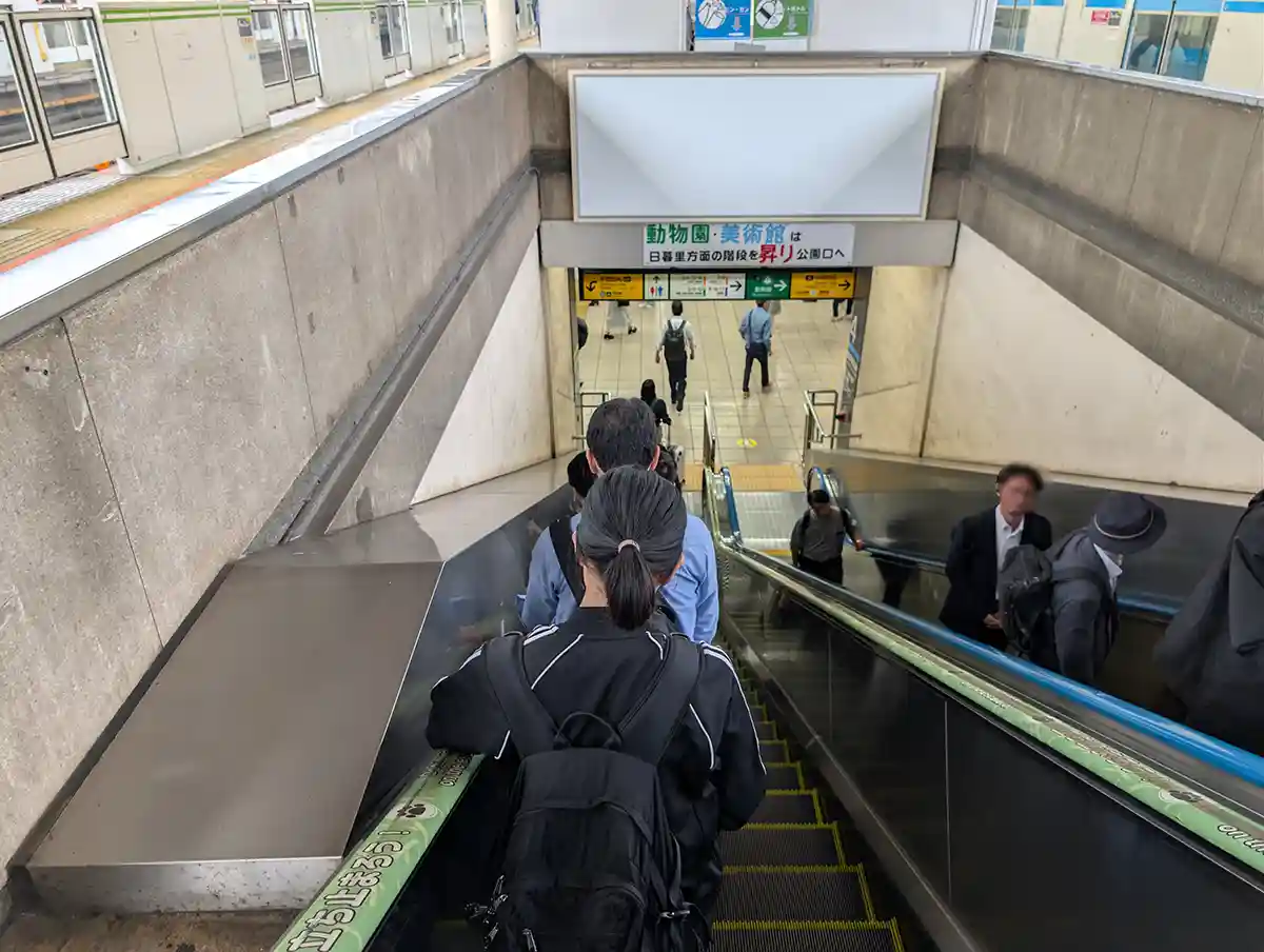 Escalator going down from a JR Ueno Station local line platform to the 1F station concourse