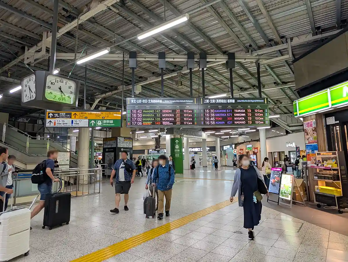 JR Ueno Station concourse leading to the Shinkansen Transfer Gate with departure boards