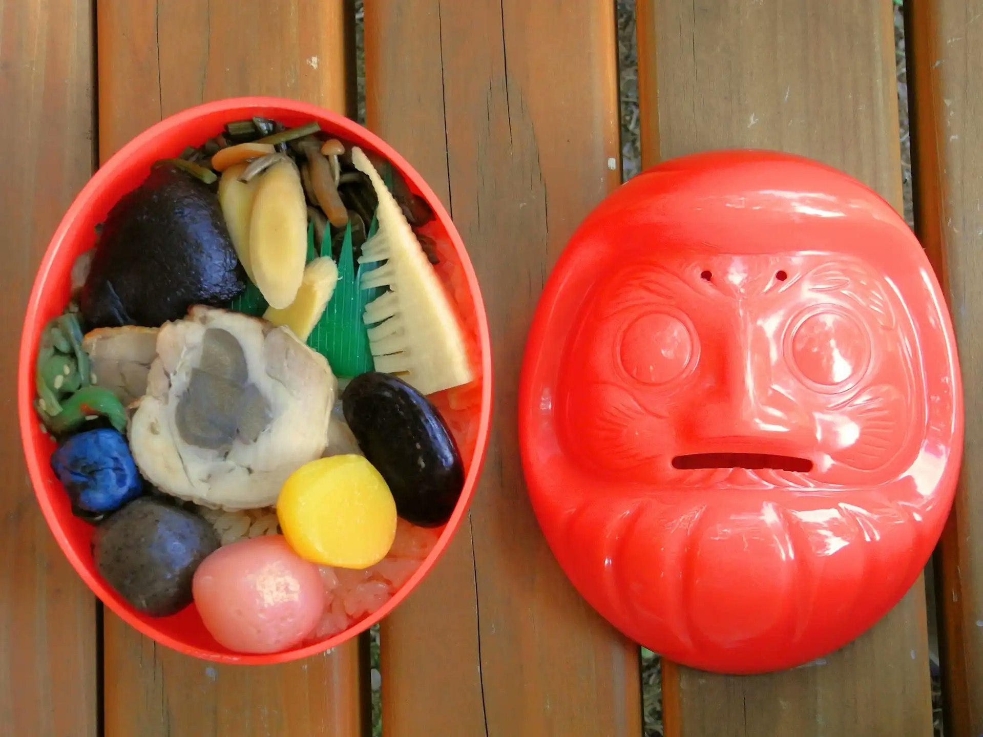 Daruma bento ekiben from Takasaki Station served in a red daruma-shaped container