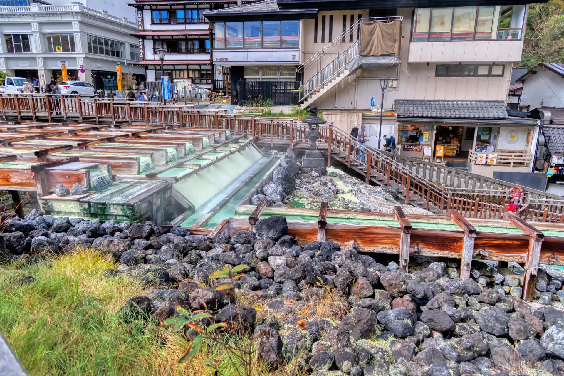 Kusatsu Onsen Yubatake hot spring field with steaming mineral waters in the town center