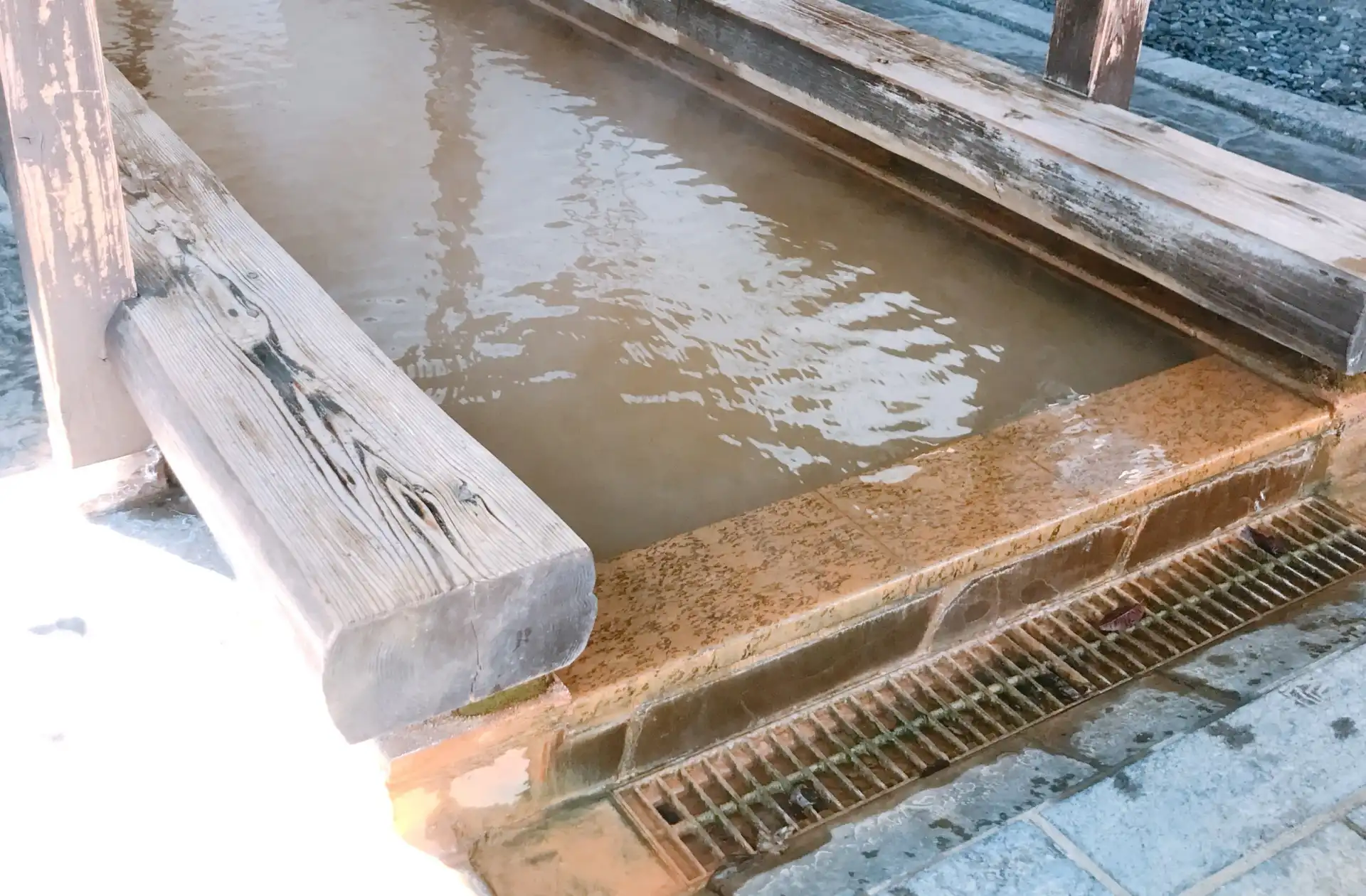 Footbath with iron-rich golden mineral hot spring water at Ikaho Onsen