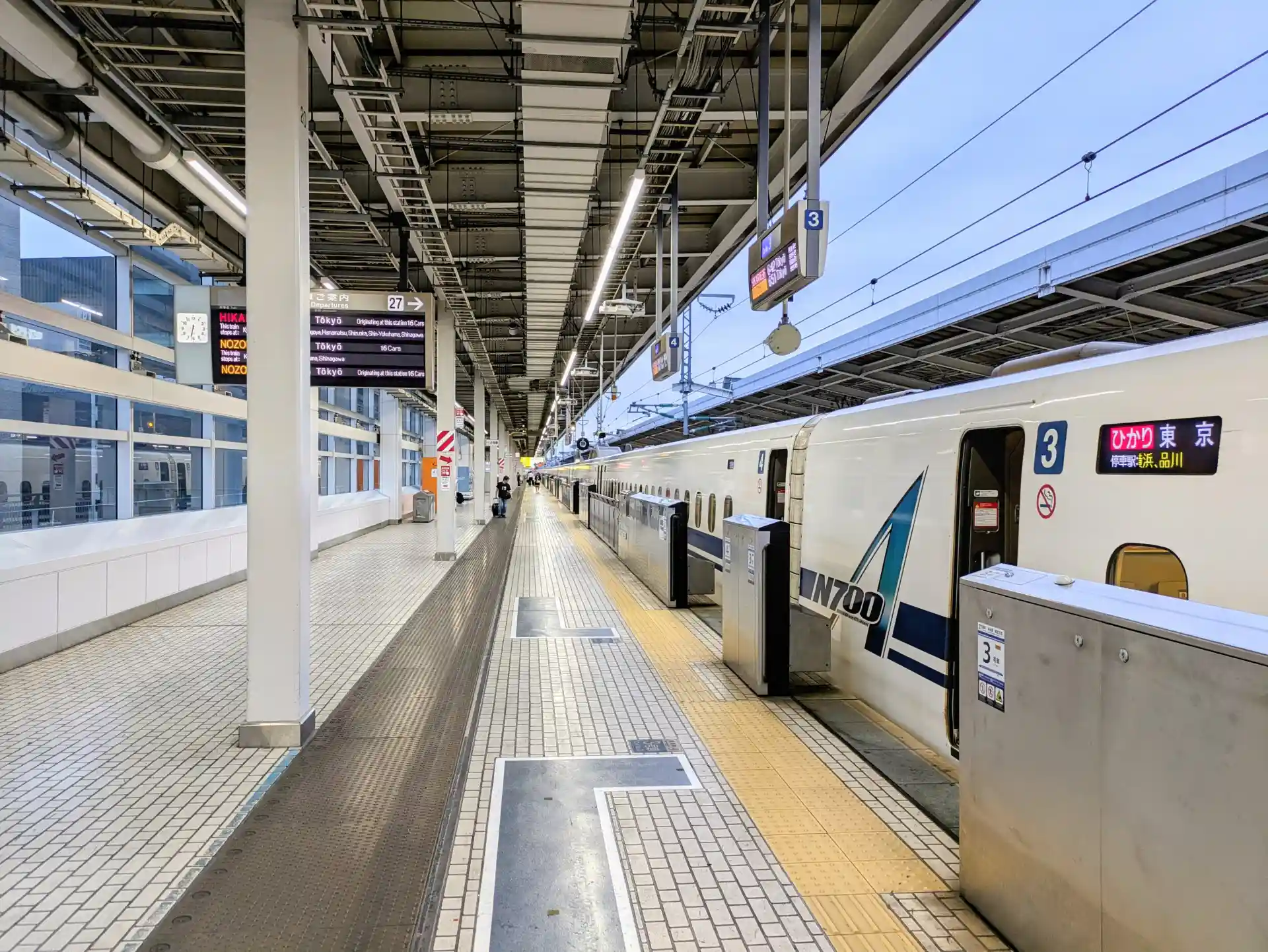 Hikari Shinkansen train on the platform showing its service name and Tokyo destination