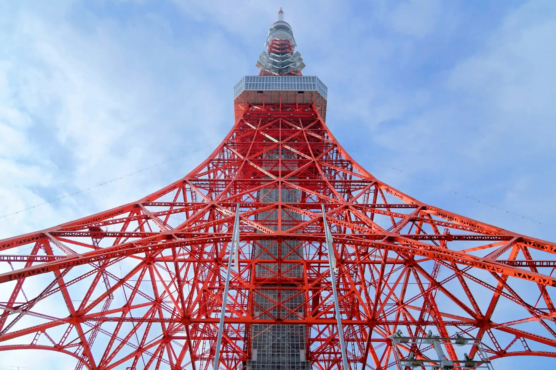 Tokyo Tower’s red steel framework viewed from the ground