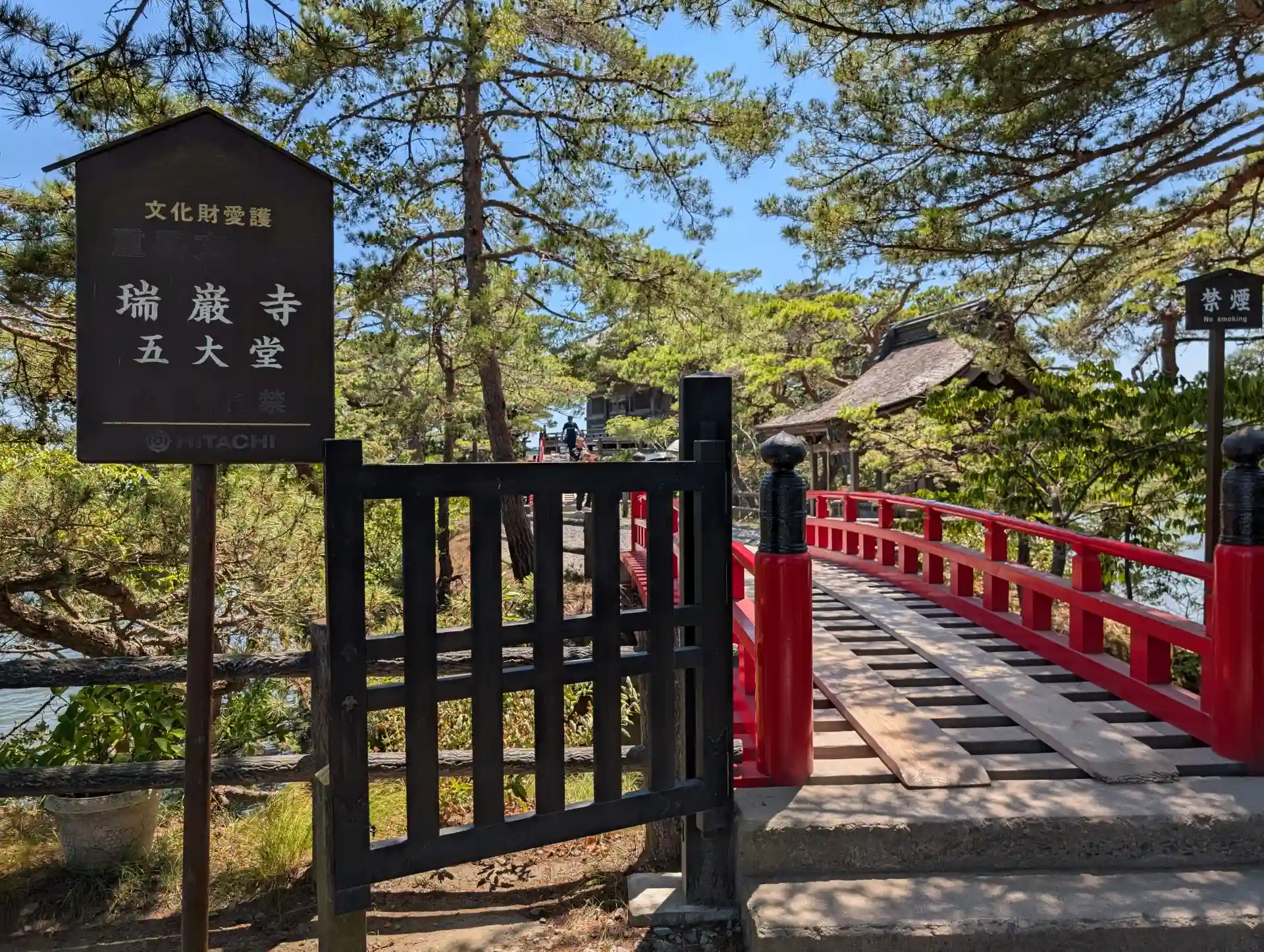 Traditional red bridge and pine forest at Godaido Hall, one of Matsushima’s iconic sights
