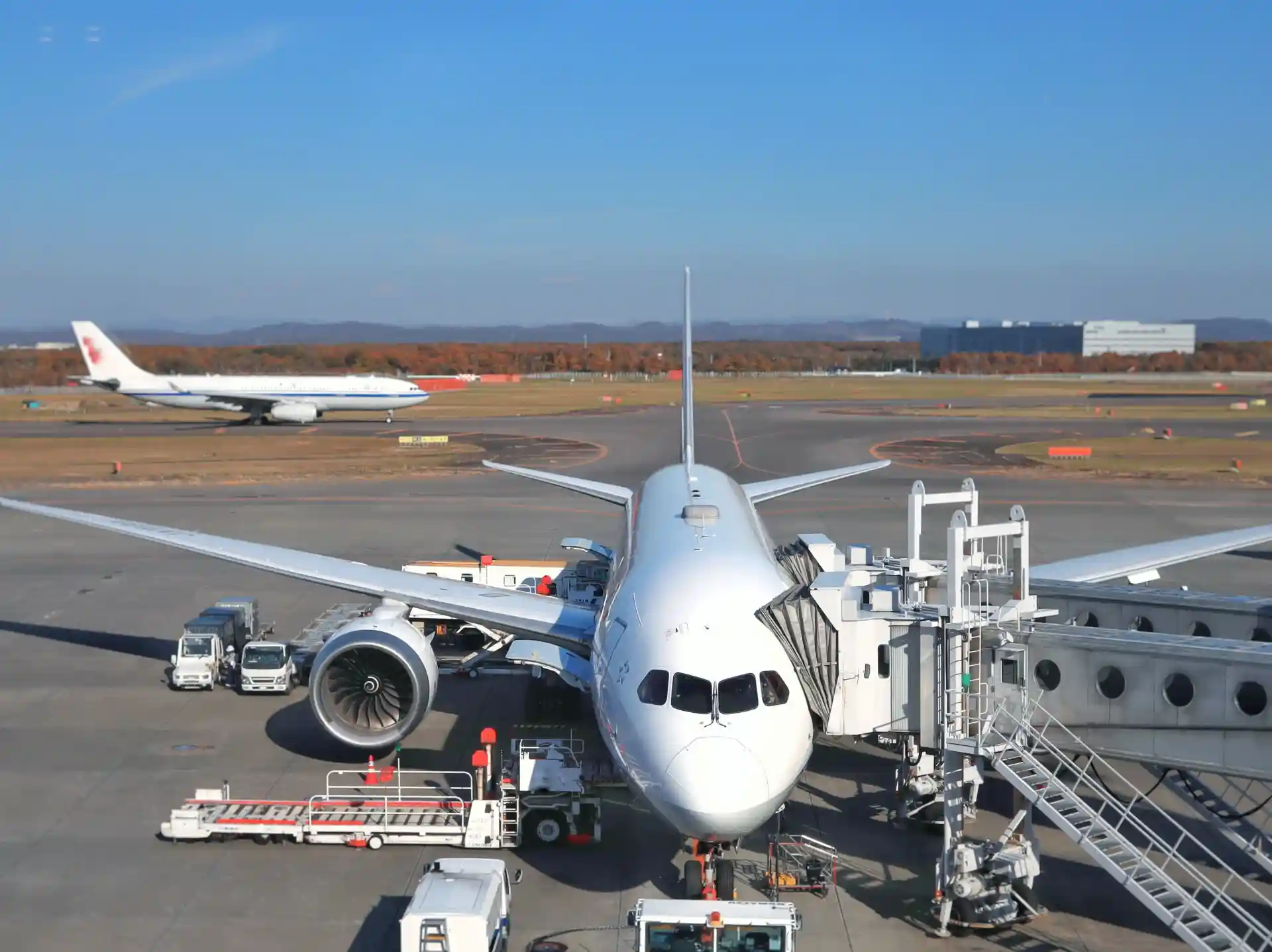 Airplane at the gate of New Chitose Airport, showing a typical flight option for travel between Tokyo and Sapporo