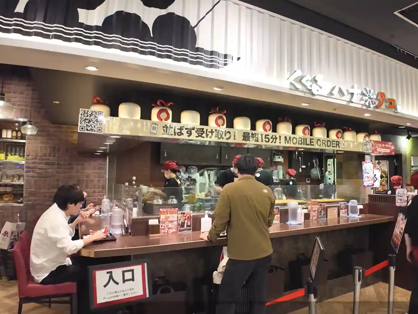 Dining area inside Eki Marche Shin-Osaka with casual restaurants and counter seating