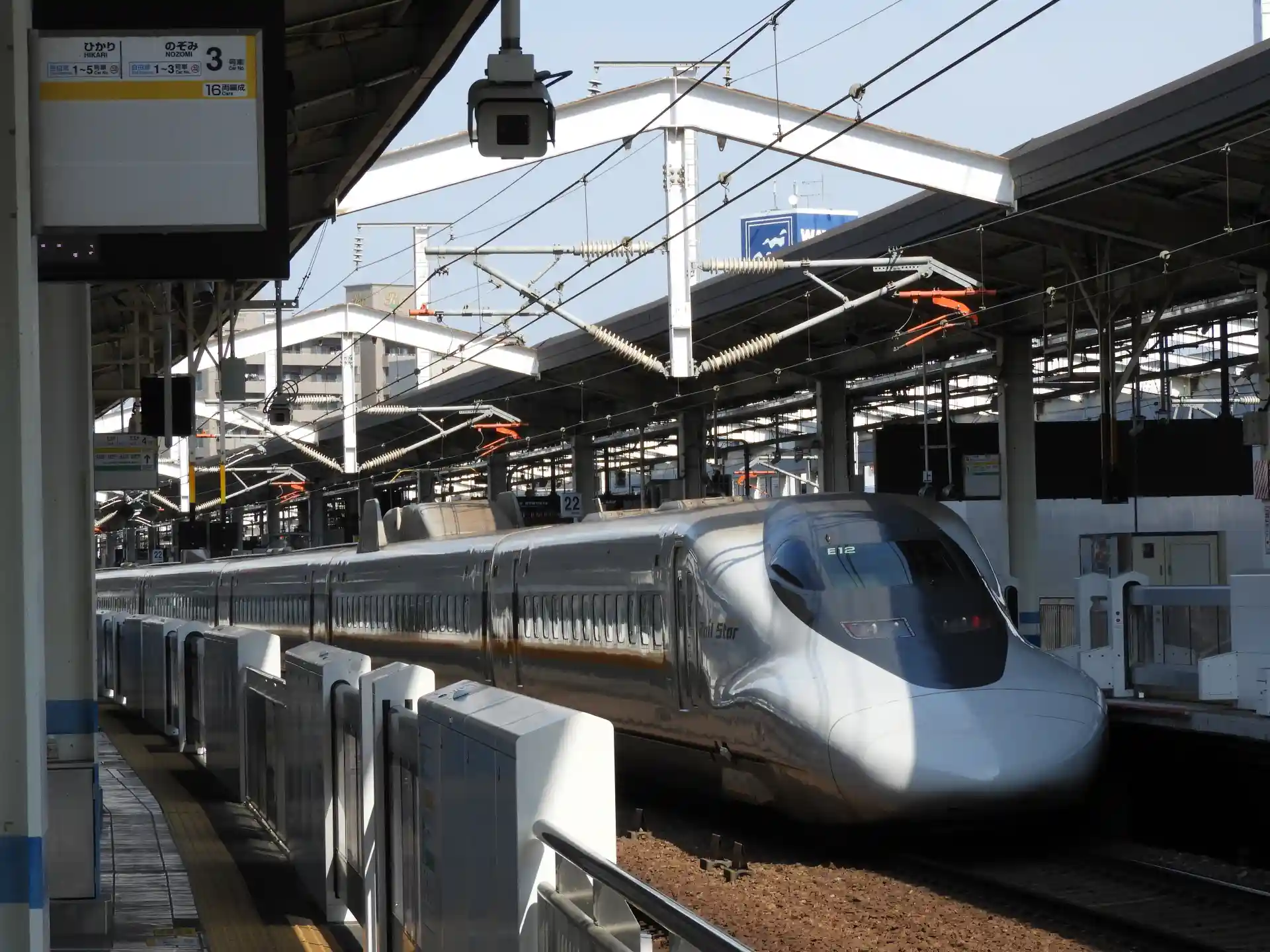 Sanyo Shinkansen stopped at Okayama Station platform, used for travel between Osaka and Fukuoka