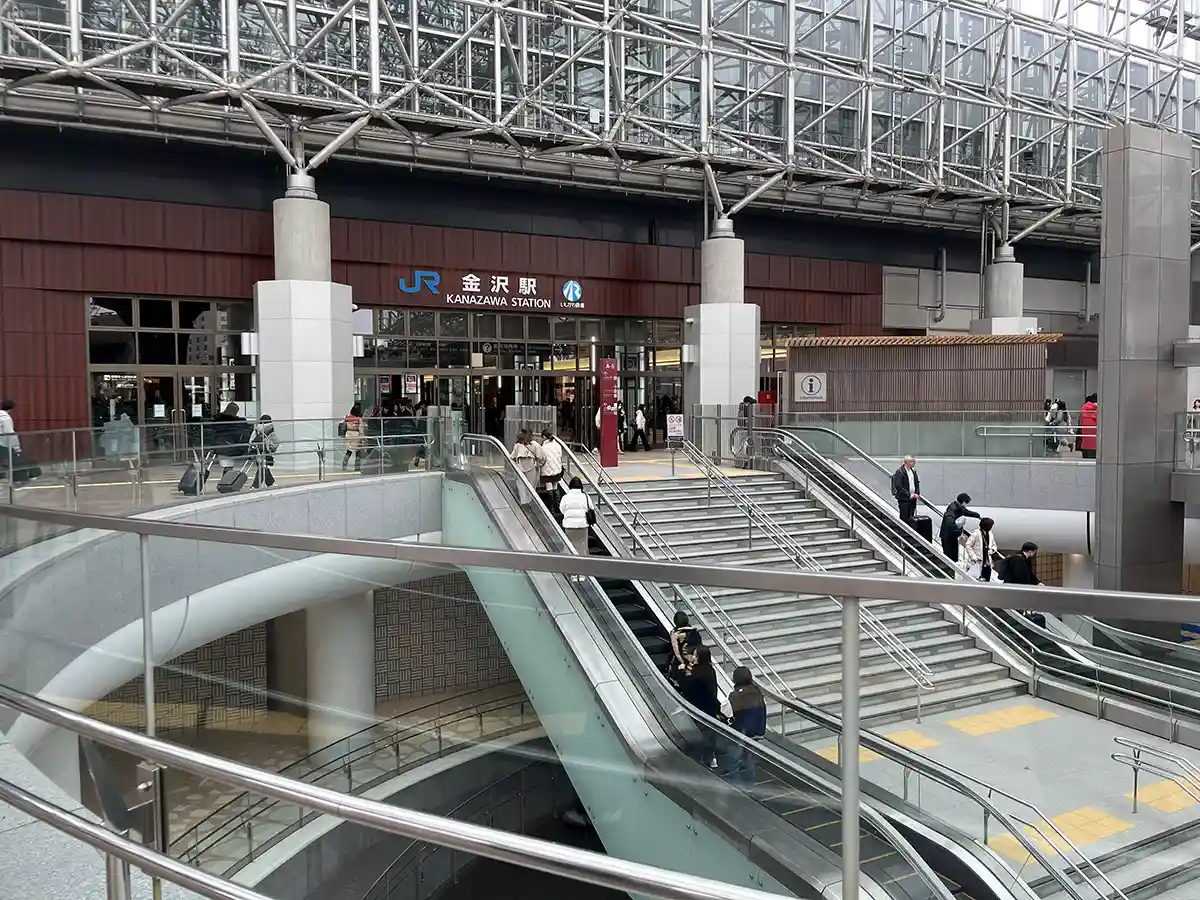 Kenrokuen Exit entrance at Kanazawa Station with stairs and escalators for station access.