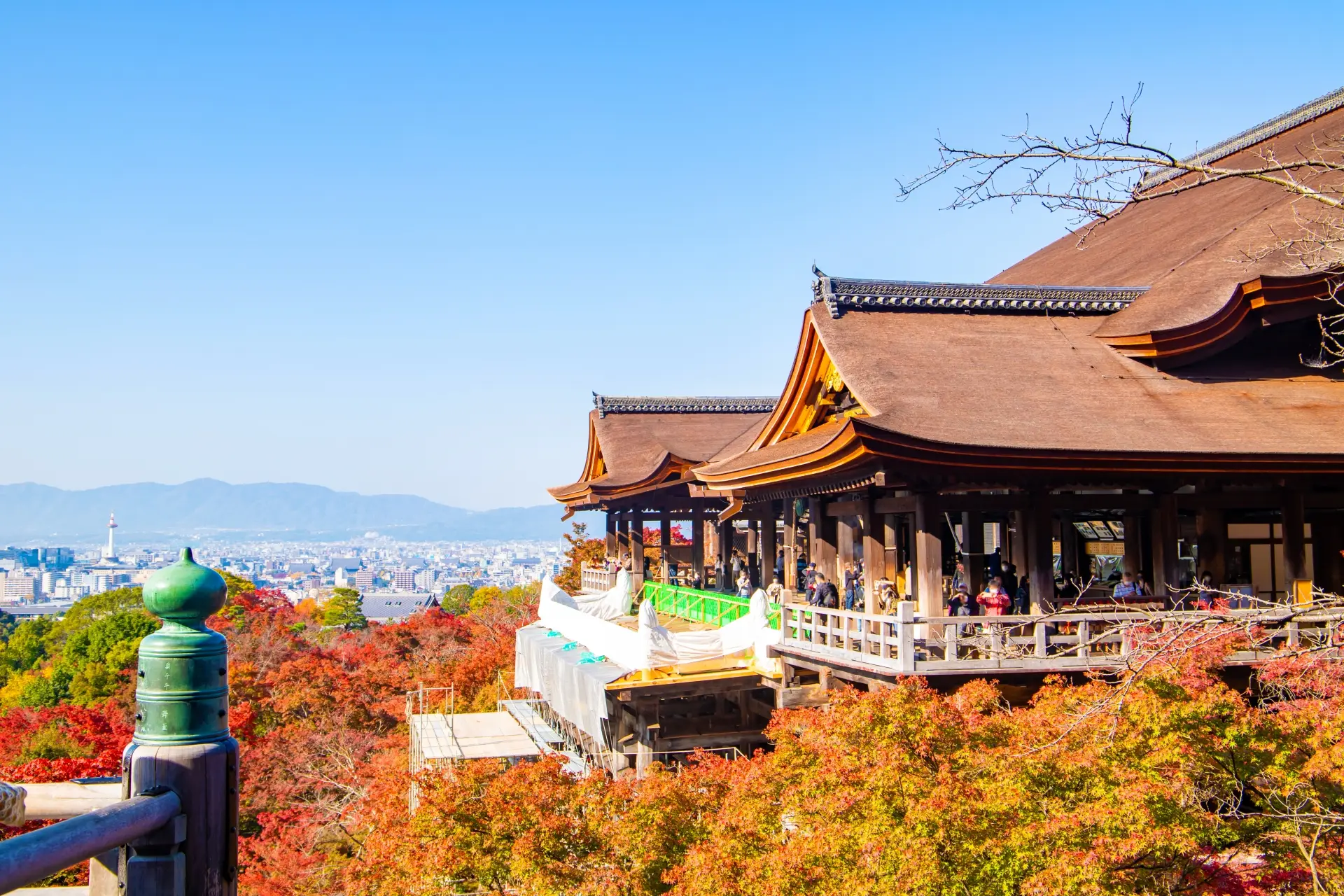 Kiyomizudera Temple in Kyoto with vibrant autumn foliage and panoramic city views