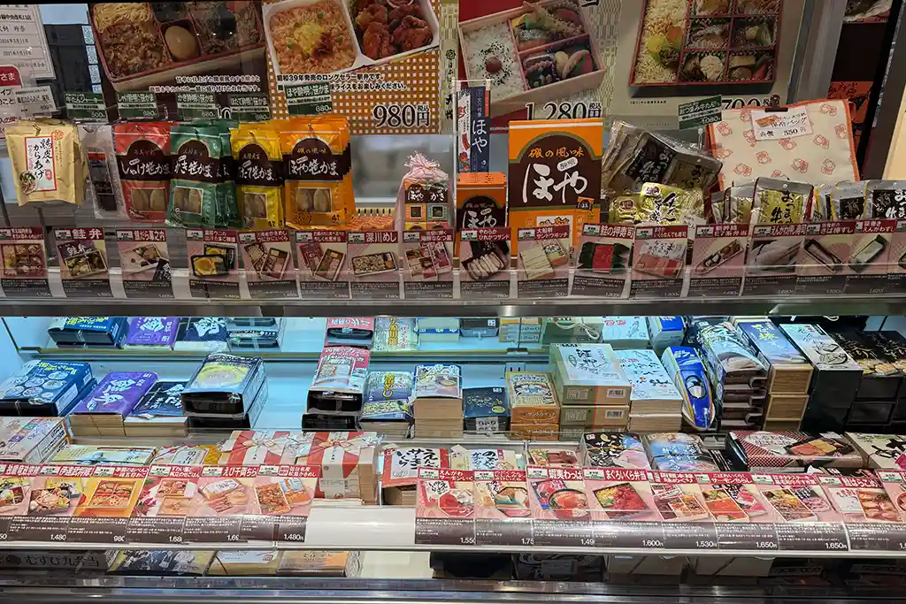 Ekiben boxes and snack items sold at Sendai Station for travelers to buy before boarding the Shinkansen.