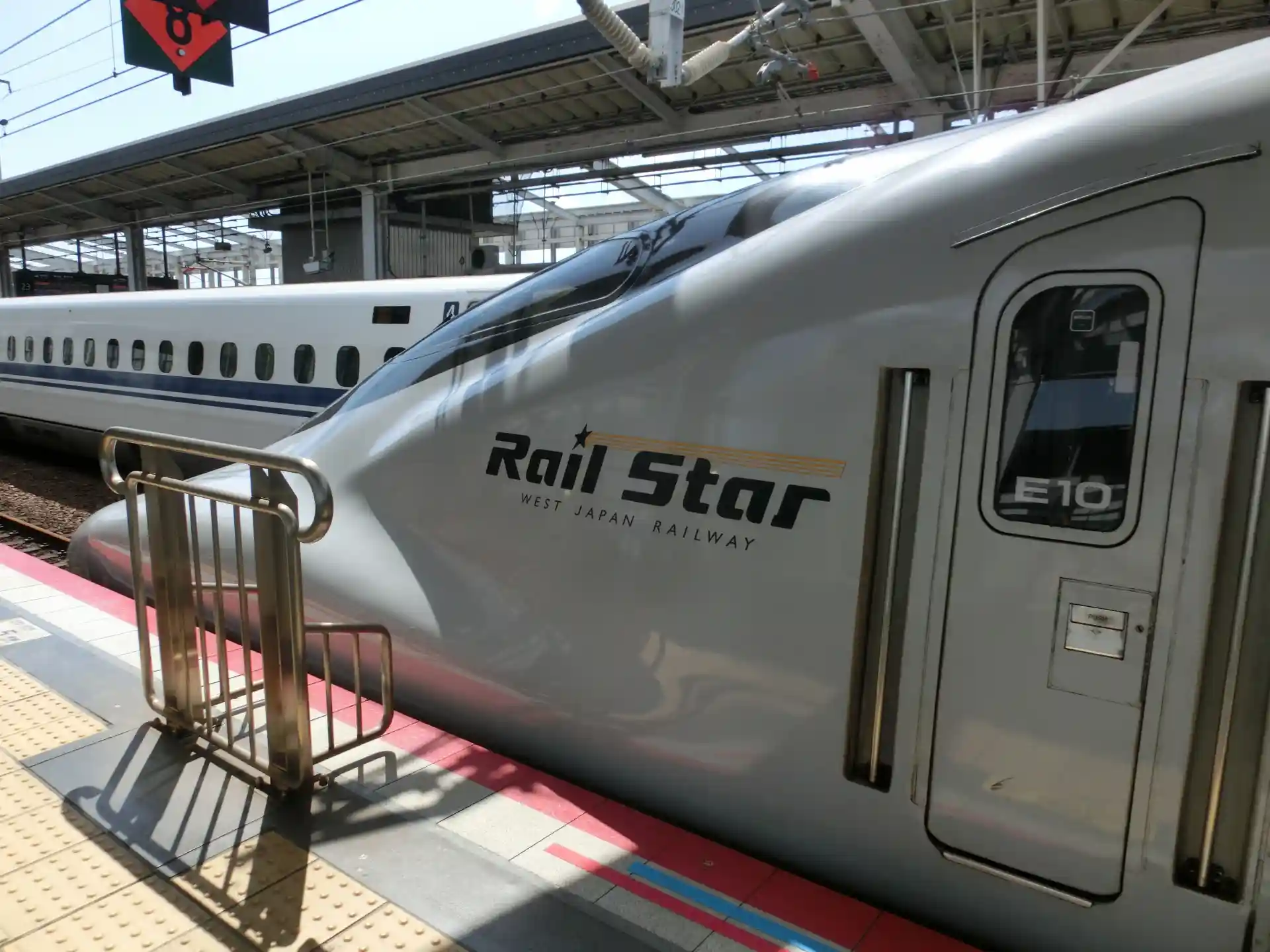 Shinkansen arriving at Okayama Station platform, illustrating the station’s role as a key transportation hub