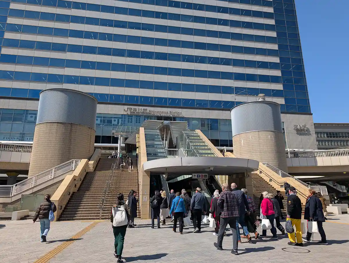 Konan East side of Shinagawa Station with stairs and escalators leading to the station building