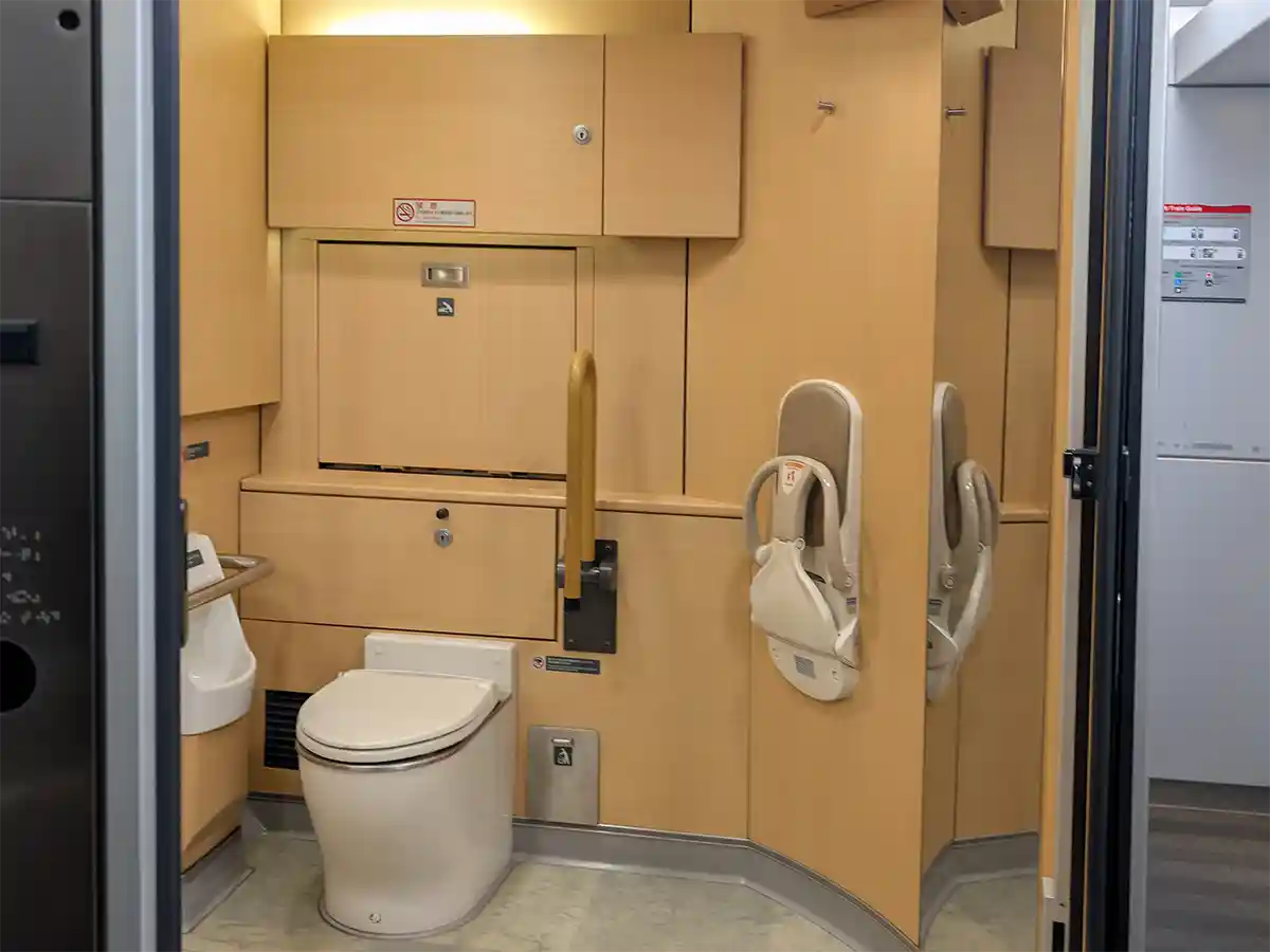 Narita Express train spacious restroom with accessible toilet and folding baby seat