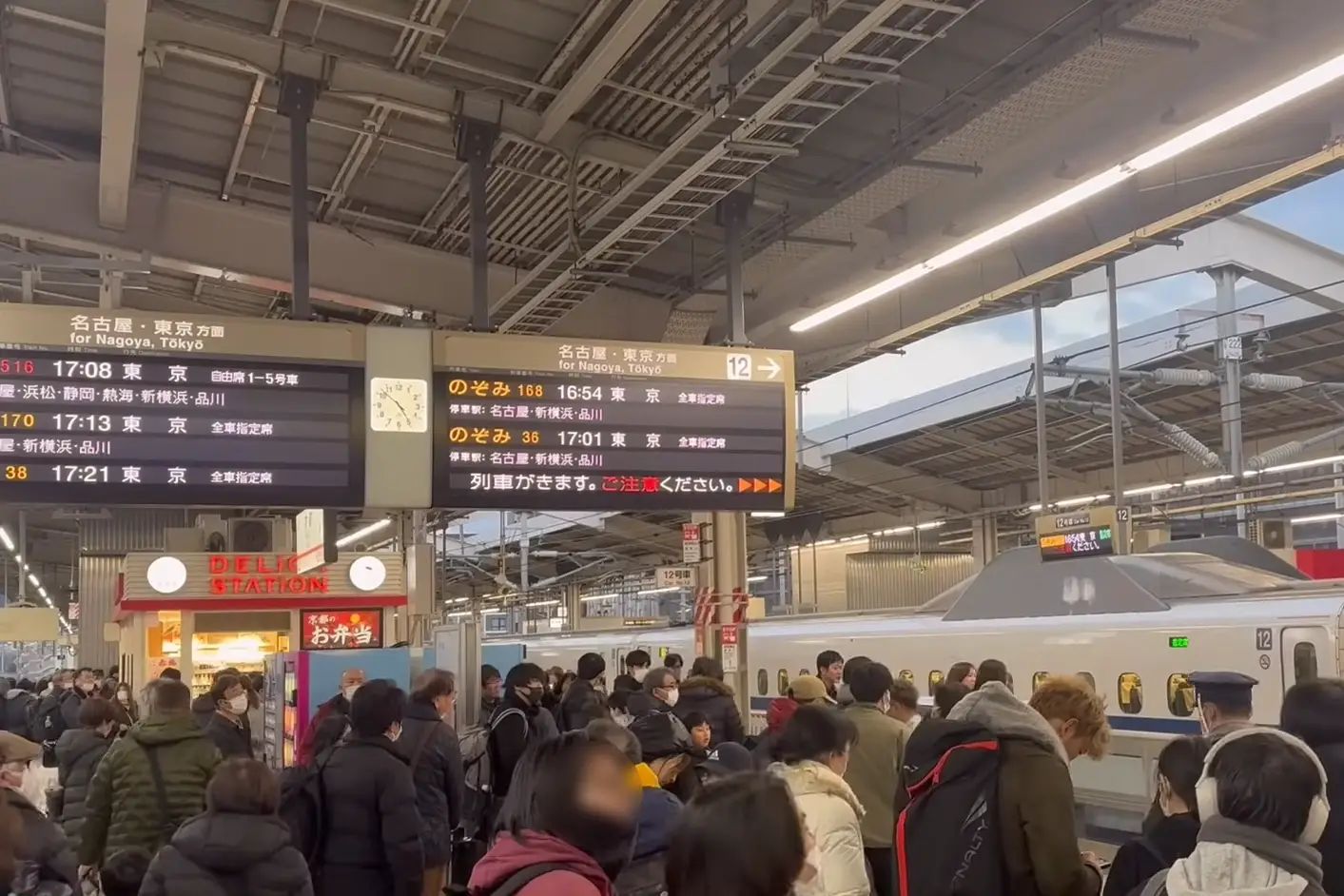 Crowded Kyoto Station Shinkansen platform during peak travel season