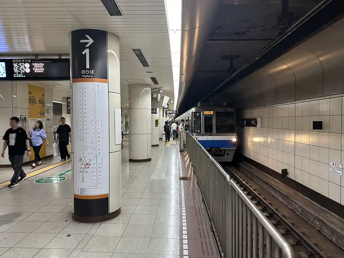 Fukuoka City Subway Kuko Line platform at Hakata Station with trains connecting to Fukuoka Airport