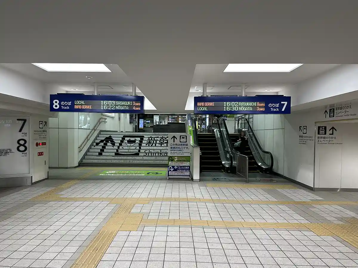 Escalator and stairs leading to the Shinkansen transfer area at Hakata Station