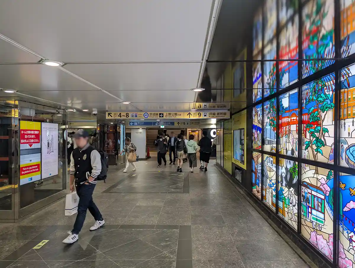 Tokyo Metro Ueno Station underground passage with signs for JR Line and Shinkansen