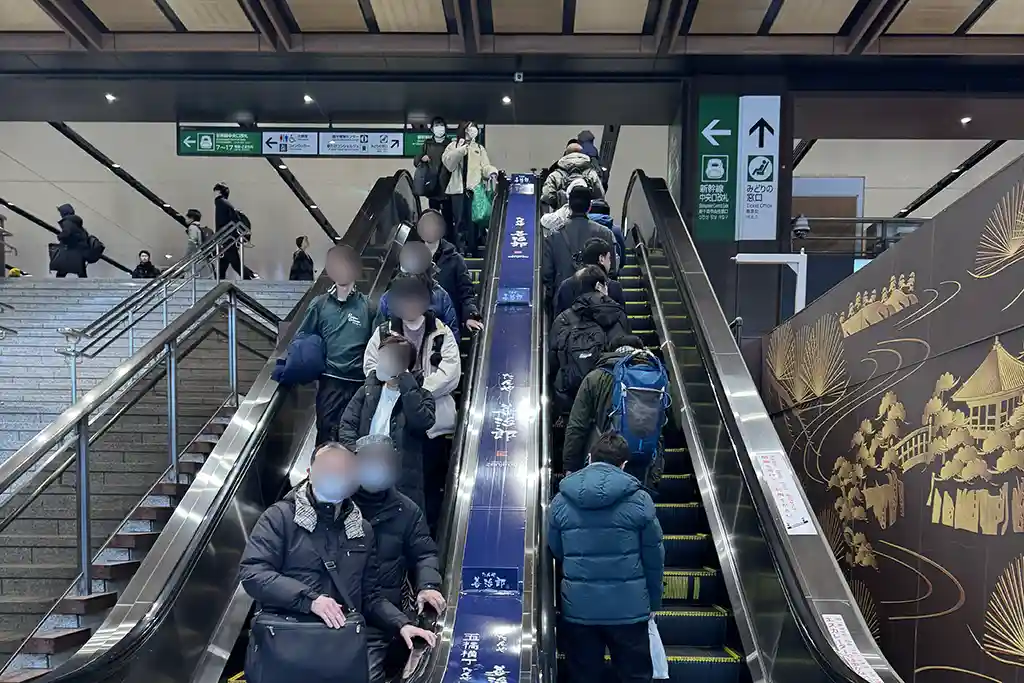 Escalator at Sendai Station West Exit guiding passengers from the second floor up to the Shinkansen boarding level.