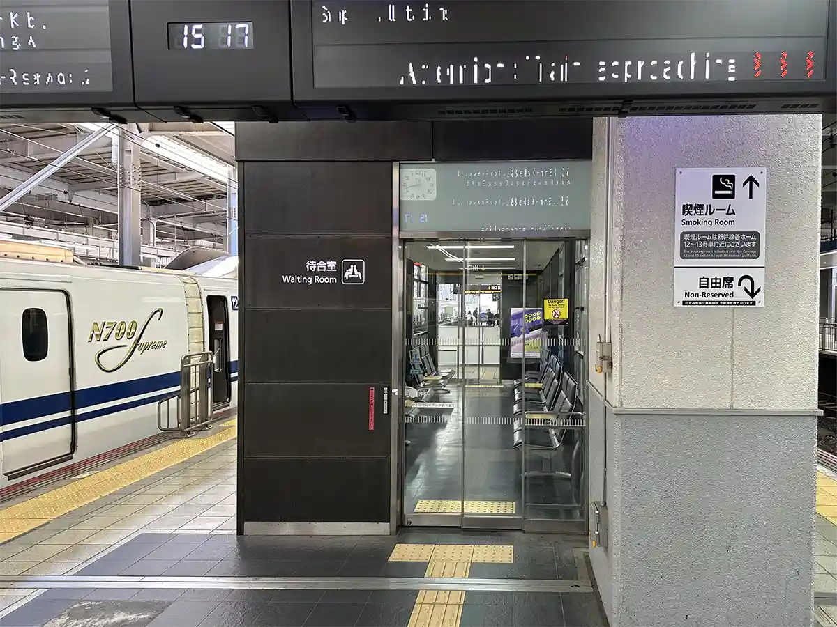 Shinkansen platform waiting room at Hakata Station near the boarding area and train cars