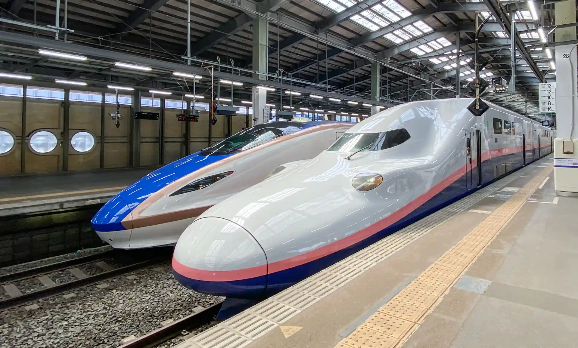 Joetsu Shinkansen train stopped at Niigata Station platform, showing the train used for travel between Tokyo and Niigata