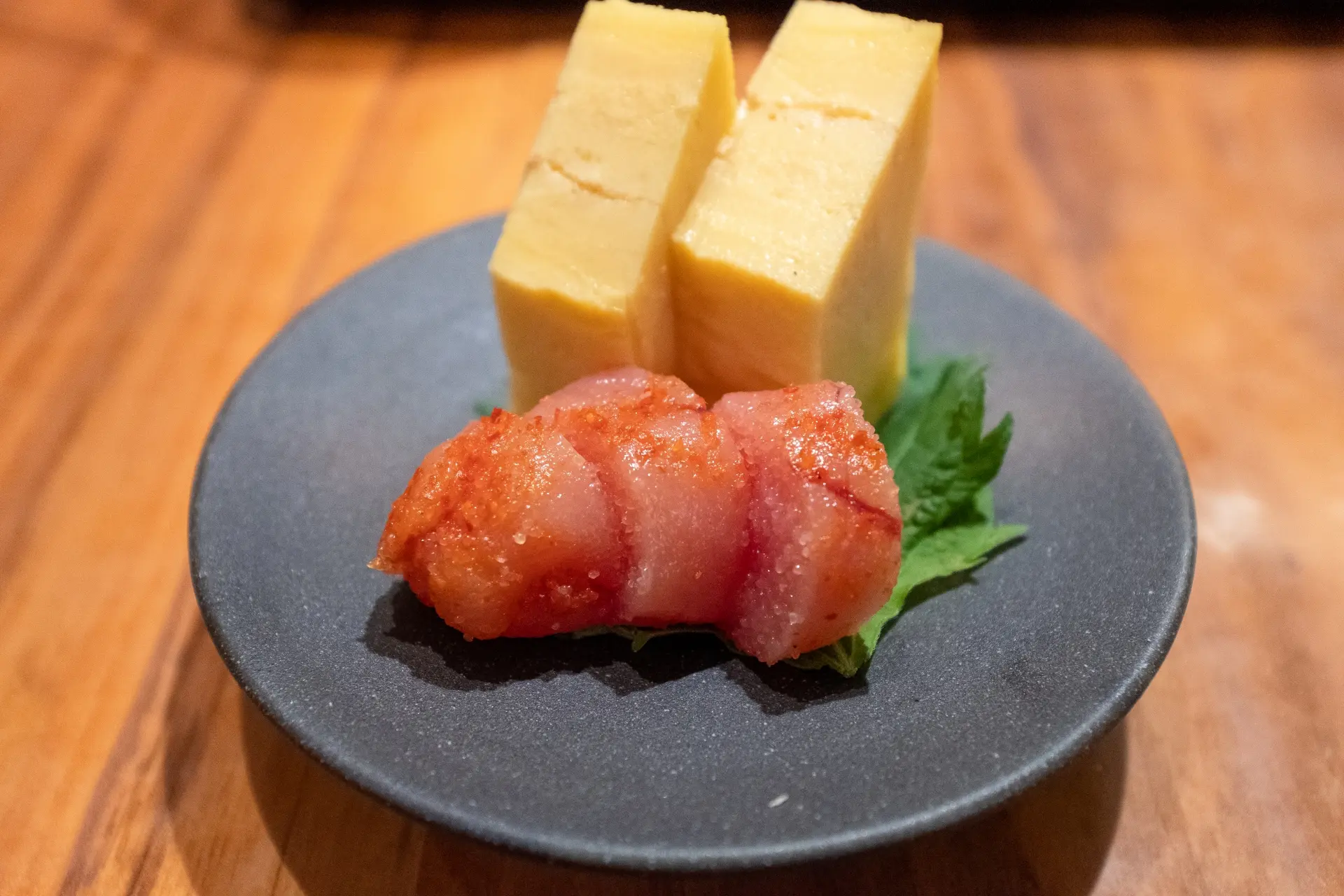 Spicy cod roe mentaiko served with tamagoyaki, a well-known Kyushu local specialty
