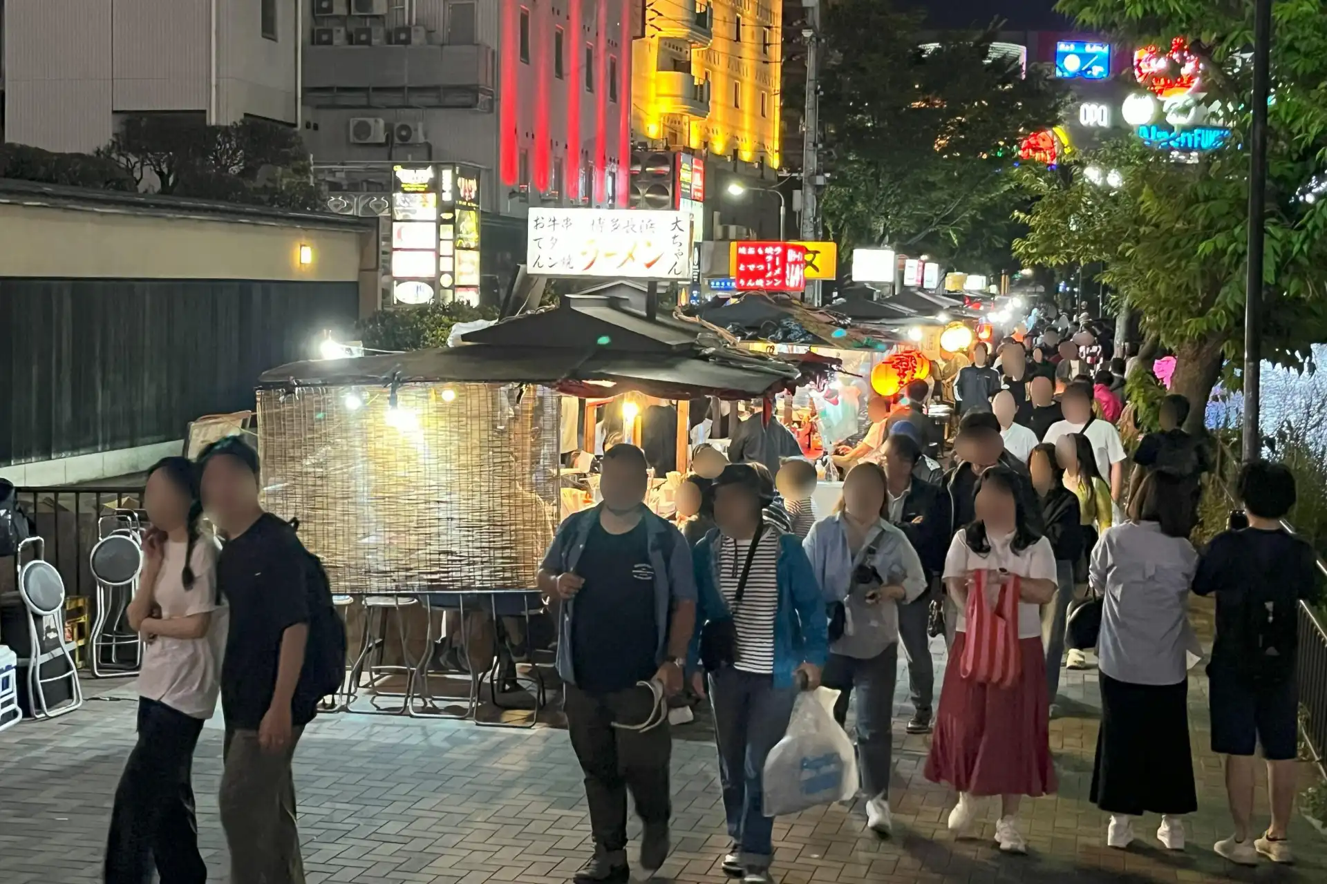 Nakasu yatai street food stalls along the river in Fukuoka at night