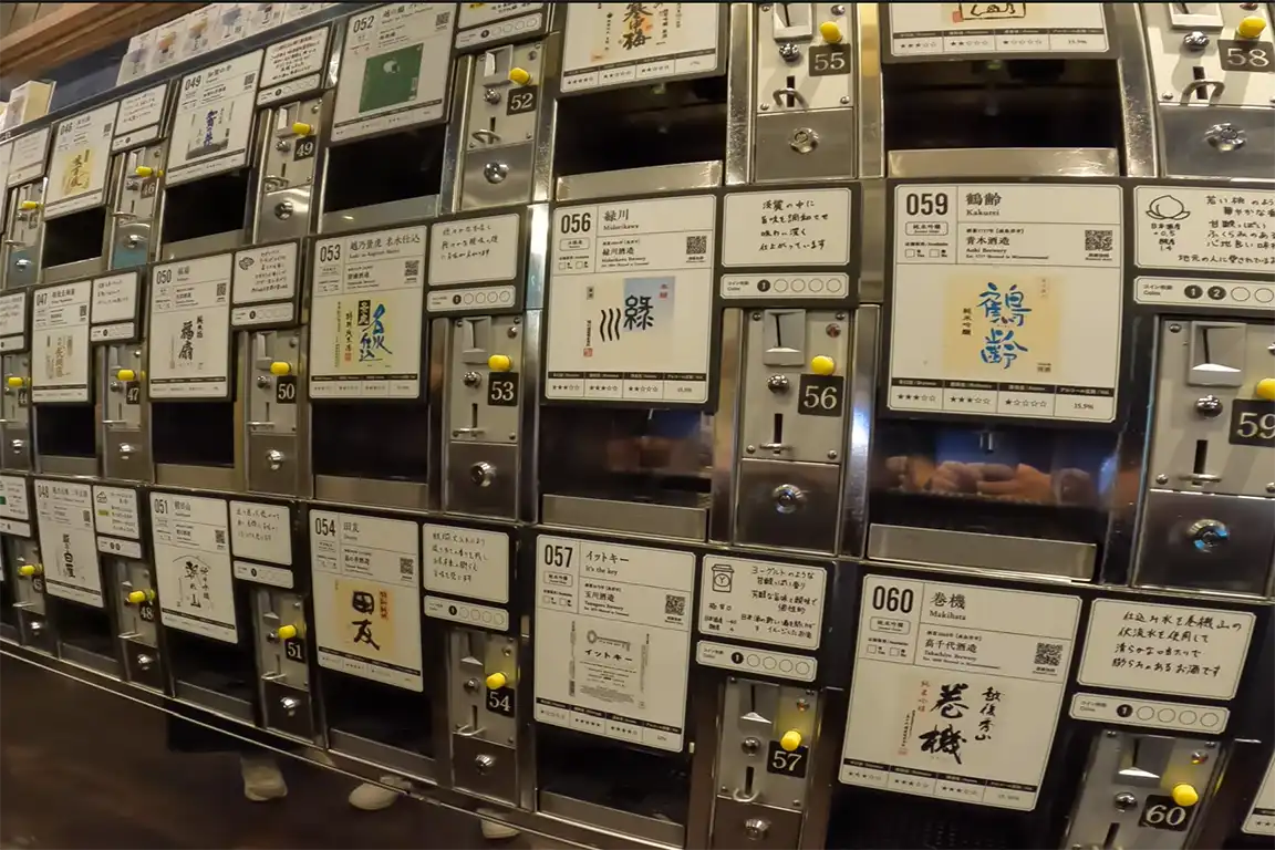 Sake vending machines at Ponshukan in Niigata Station, allowing travelers to sample local Niigata sake by coin system