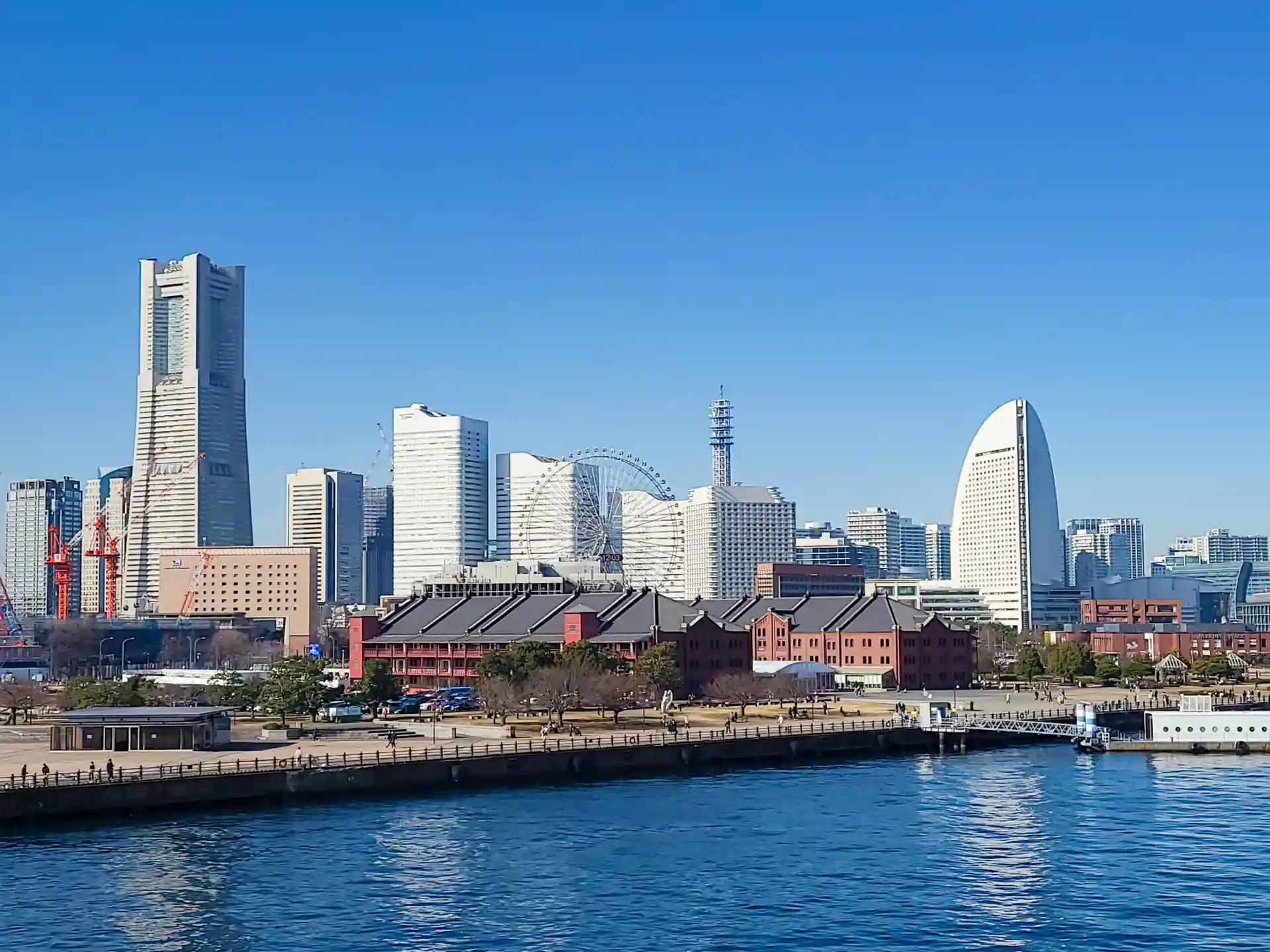Minato Mirai cityscape in Yokohama with bay water, skyline, and historic brick buildings